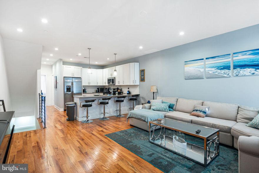 Condo can come furnished or unfurnished!

Welcome to 1213 N 5th St, Unit 2, a stunning multi-level condo in the heart of Old Kensington offering modern amenities, spacious living, and incredible outdoor space.

Step inside to a bright and airy first-floor living area featuring hardwood floors and plenty of space for a large sectional. A big window floods the room with natural light, creating a warm and inviting atmosphere. The open-concept kitchen and dining area is designed for both functionality and style, boasting a large island with seating for four, white cabinetry, stainless steel appliances, a French door refrigerator, and a dishwasher. The first-floor bedroom is generously sized, with room for a work-from-home setup, a comfortable bed, a closet, and another large window. A full bathroom completes this level.

Upstairs, you'll find two additional bedrooms, each with ample space, along with two full bathrooms and a convenient laundry area.

One of the standout features of this home is the massive private roof deck, perfect for entertaining, soaking in stunning Philadelphia skyline views, or enjoying a warm summer evening.

Additional perks include one deeded parking spot in the driveway—a rare find in the city!

Located in vibrant Old Kensington, you’ll be just minutes from trendy cafes, restaurants, shopping, and public transit, making city living effortless.

Don’t miss your chance to own this exceptional home! Schedule your showing today.