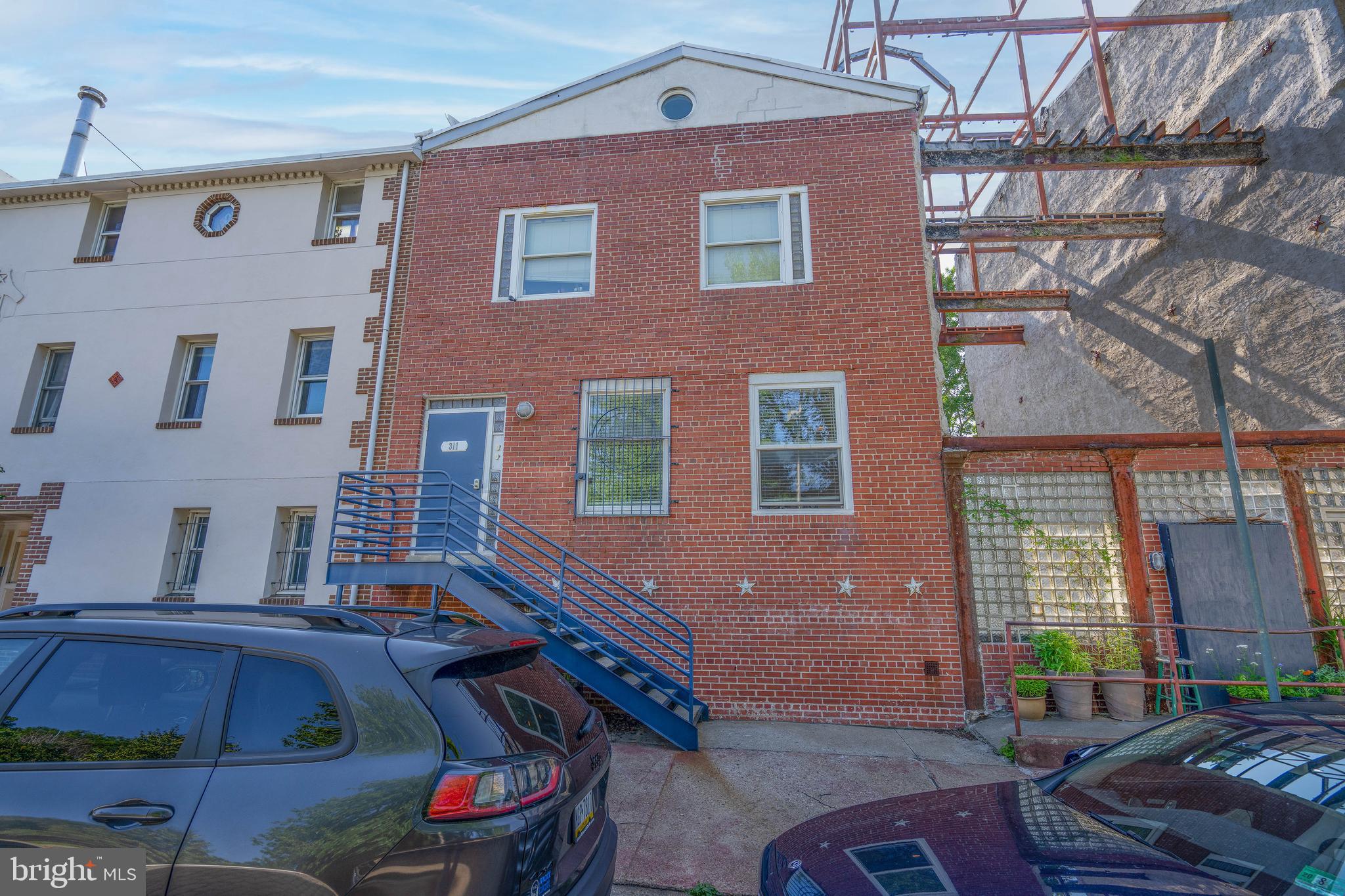 Fully Renovated Income-Producing Historical Triplex in Old City with Parking & Stunning Bridge Views!
Located in the heart of Old City, this beautifully renovated 3-unit triplex is a rare opportunity for investors or owner-occupants seeking style, space, and strong rental income. Each unit blends modern amenities with thoughtful design, offering comfort, flexibility, and unique character.
Unit 1: Chic and sun soaked 1 bed / 1 bath with a private balcony, new HVAC, dishwasher, washer & dryer, and heater.
Unit 2: Spacious 2 bed / 1 bath featuring soaring ceilings, a lofted office space, tons of storage, new stove, dishwasher, washer & dryer, and a light-filled open layout.
Water St Unit: A truly one-of-a-kind 1–2 bed / 1 bath residence with a large bay door that opens to the outdoors for seamless indoor/outdoor living. This historic space features a distinct industrial vibe with exposed brick walls, steel beams, and a cozy fireplace. During renovations, a previously hidden tunnel dating back to the 1600s was uncovered and carefully excavated, revealing original stonework and architectural elements that had been concealed for centuries. This remarkable discovery adds approximately 220 square feet of unique, usable space to the unit, perfect for a creative studio, wine cellar, or private retreat. The unit also includes new HVAC, microwave, tankless water heater, washer & dryer, and a private 5x8 storage closet.
All three units offer hardwood floors, stainless steel appliances, quartz countertops, recessed lighting, large modern bathrooms, ample storage, and plenty of natural light. The building also features a stylish tiled foyer, brand-new roof and gutters, and parking.
Enjoy breathtaking views of the Ben Franklin Bridge and Delaware River and enjoy the sunrise every morning from all 3 units. Just steps away from the best of Old City’s historic charm, art scene, and vibrant dining. Easy access to 95, 676 & 76, The Ben Franklin Bridge and just a short walk to public transportation. One of Old City's favorite dog park is right across street. Whether you're looking to live in one unit and rent the others or expand your investment portfolio with a truly exceptional property, this triplex delivers space, income, and unmatched character. This is not just a property, it’s a piece of Philadelphia’s living history.