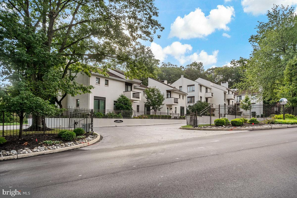 Welcome to Arbordeau, a gated community in Devon known for its French-inspired design and beautifully maintained 15-acre setting. An onsite manager and dedicated maintenance staff ensure everything runs smoothly, while residents enjoy resort-style amenities including a pool, clubhouse with entertaining space, and rentable guest suites. HOA fees cover all exterior upkeep, including roof, stucco, and gutter maintenance, landscaping, snow removal, water, sewer, and trash and in-unit cable service. Making ownership here truly turnkey and worry free. This one-bedroom, one-bath home has a bright, open layout with a combined living and dining area that connects to a private balcony overlooking the grounds. The spacious bedroom also opens to a private outdoor space and offers excellent closet storage. Added conveniences include underground parking, a deeded storage room, and a dedicated elevator that opens directly into the home.
Located just minutes from downtown Wayne, Devon Yard, Jenkins Arboretum, and major commuter routes, this property offers an easy, low maintenance lifestyle in a highly desirable Main Line setting. Ideal as a primary residence or a lock-and-leave option, it’s a wonderful opportunity to enjoy both comfort and convenience in Arbordeau.