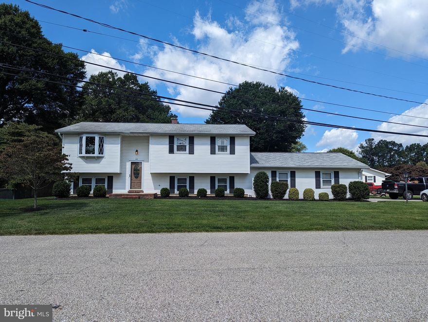 Well maintained split foyer in water privileged community.  Oversized garage. Well landscaped yard. Deck with handicapped accessibility. Basement has two recreational rooms. Extra fridge in basement. Home is being sold as is.