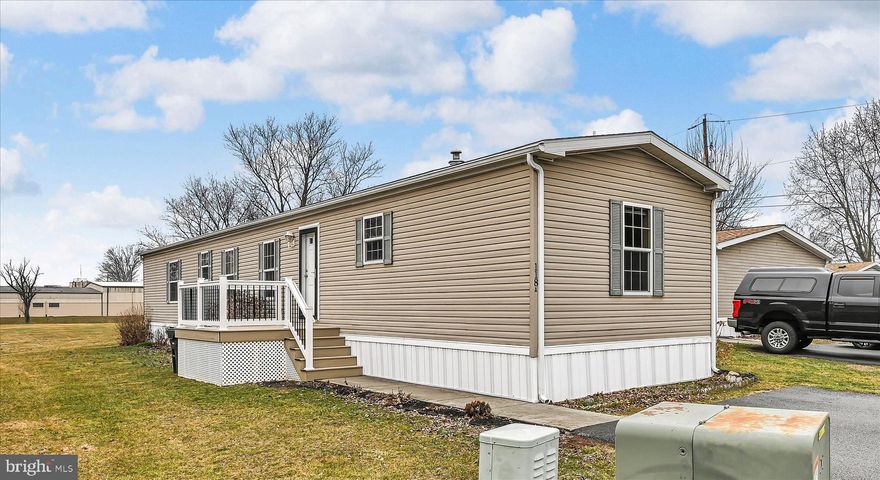 Charming and well-maintained, this single-wide mobile home is in a peaceful 55+ community — move-in ready and thoughtfully cared for. From the new deck at the front door, step into the bright, open Living Area with neutral décor, which flows into a lovely, efficient Kitchen with abundant cabinet storage. The adjacent Laundry Room provides ease and convenience with a little more storage space. 
The comfortable primary bedroom features a full bath and walk-in closet. Two additional bedrooms and another full bath complete the home.
Outside is a tidy storage shed which provides convenient outdoor space and storage. Located on a quiet street within a friendly, age-restricted community, you will find well-kept lawns and common areas and easy parking. Convenient to nearby shopping and medical services — ideal for downsizing or relaxed, independent living.