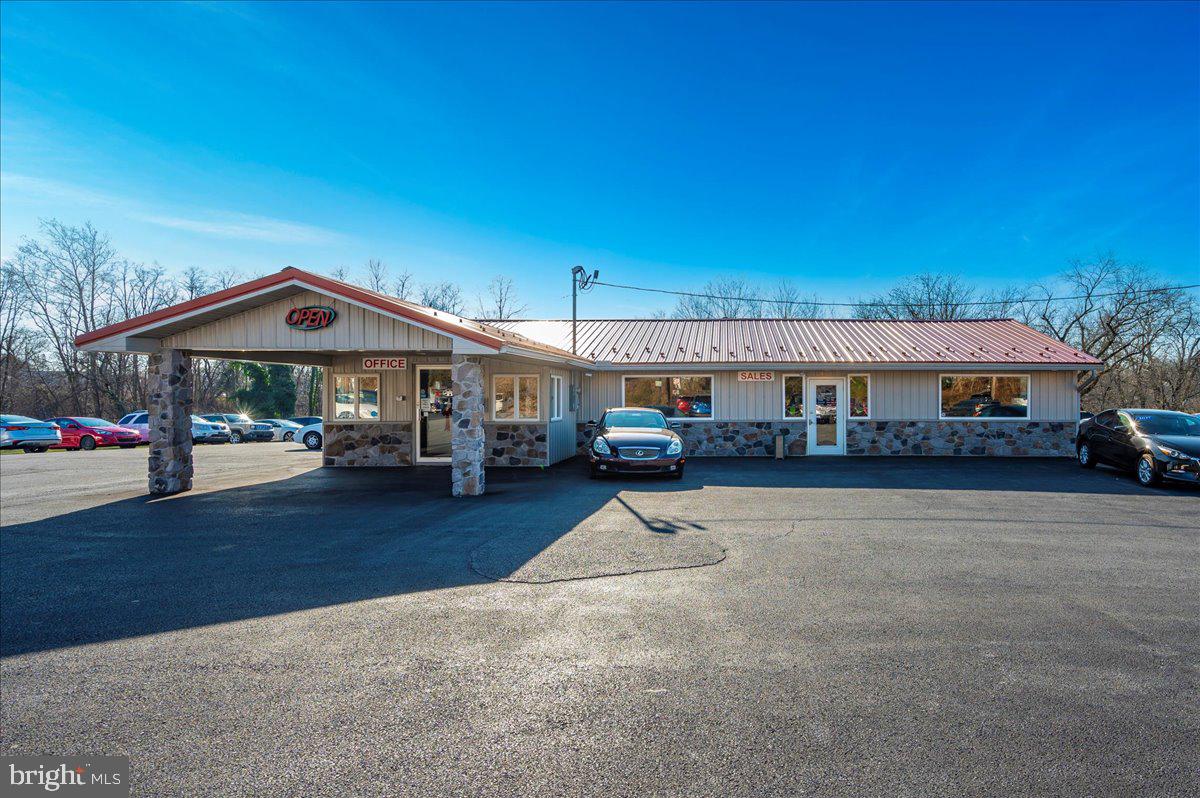 Unlock the potential of this thriving turn-key car dealership in Chambersburg, PA! Featuring a spacious 6-bay garage with 4 x 10' and 1 x 12 doors, a comfortable customer waiting area, and abundant storage, this property is ready to drive your business to success. The expansive 50,000 sq. ft. blacktop offers ample space to showcase a large inventory of vehicles. The on-site garage provides a lucrative opportunity to generate additional income through outside repairs. With the owner willing to offer startup assistance, this dealership is a rare opportunity you can’t afford to miss. Act now to accelerate your business dreams!