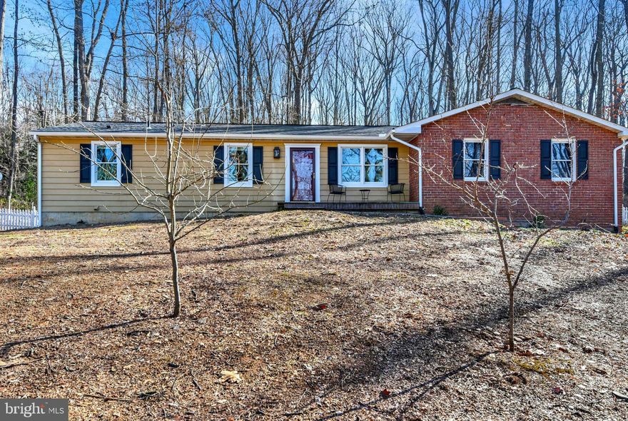 Enjoy a quiet setting nestled in the trees on Leppo Rd. This home features a new roof with new gutters, leafguard and downspouts, new complete central heat and A/C including all new duct work, new appliances, 150" 10 speaker home theater, huge 2 car garage with 14' ceilings and a fresh interior. Large kitchen with plenty of work and storage area. Owner would like to leave furniture, riding mower and lawn equipment.