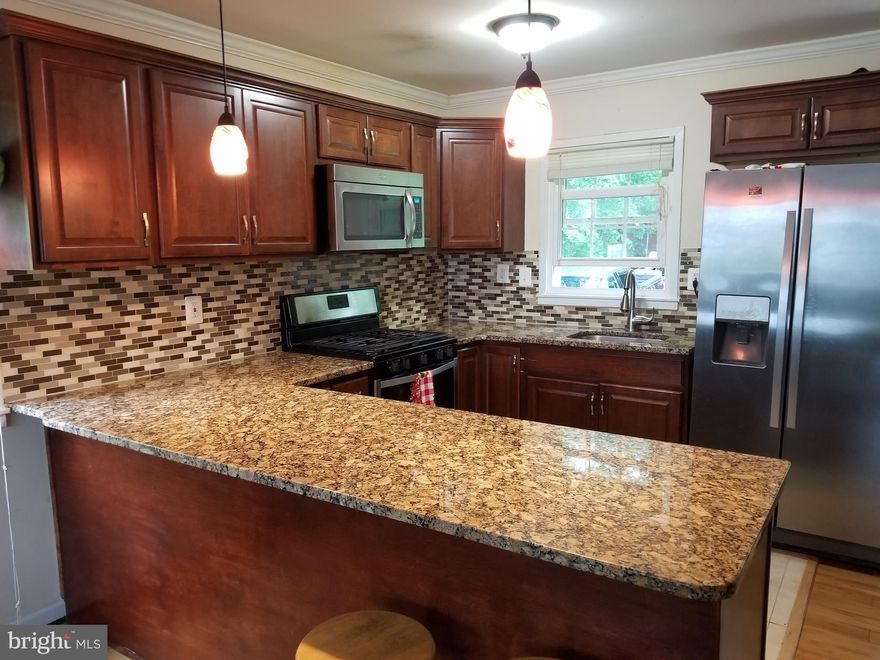 Nice home located in a quiet neighborhood, close to schools4 bedroom( 4th bedroom in the basement is NTC), 2 1/2 bathrooms, upgraded kitchen, 2nd kitchen in the basement, stainless  steel appliances, beautiful back splash, hard wood floors in the mainlevel, huge back yard with custom patio!