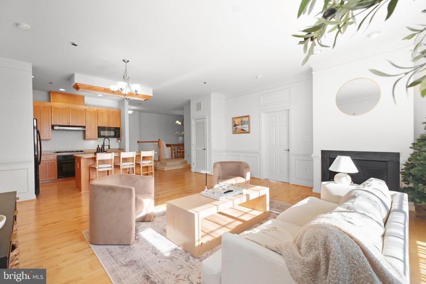 Nestled in the amenity-rich Belmont Bay neighborhood, this stunning condo is a perfect blend of comfort and sophistication. With thoughtful updates over the years, this home is move-in ready. The open kitchen boasts hardwood floors, beautiful cabinetry, Corian countertops, and abundant storage space, making it both functional and stylish. Its seamless connection to the main living area creates an effortless flow, perfect for everyday living and entertaining. Elegant touches like wainscoting, crown molding, and chair rail trim add a touch of luxury to the spacious living and dining areas. A versatile den offers endless possibilities, whether you need an office, a cozy TV nook, or a formal dining area. The light-filled primary suite is a retreat unto itself, featuring large closets and an ensuite bathroom with a soaking tub, separate shower and double vanity. The second bedroom also includes a walk-in closet and its own ensuite bathroom, providing convenience and privacy for guests or family members. Step outside to a generous private balcony, the perfect spot to relax and enjoy the outdoors. 

Located in a secure building, this condo includes an assigned garage parking space (#7) and is the only condominium in Belmont Bay offering a rooftop common area with breathtaking views of the bay. Belmont Bay residents enjoy a wide array of community amenities, including a marina, walking trails, a pool, tennis courts, and organized events that bring neighbors together. Conveniently situated near I-95, VRE, Route 1, Potomac Mills Mall, and Stonebridge, this home offers easy access to shopping, dining, and commuting options.