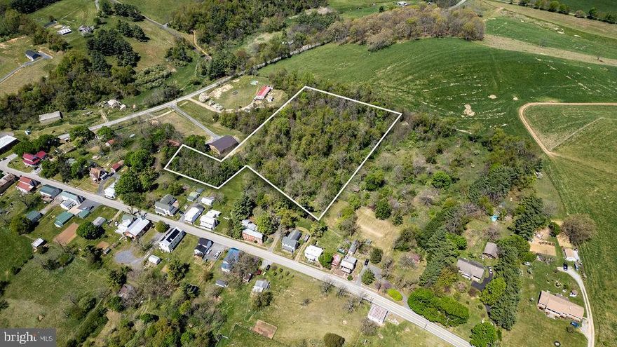 Build your dream home in the middle of quaint Middlebrook Village. Wooded building lot in Middlebrook, plus two other 1/4 acres lots that are included. County water is available and it borders a large farm in the back.