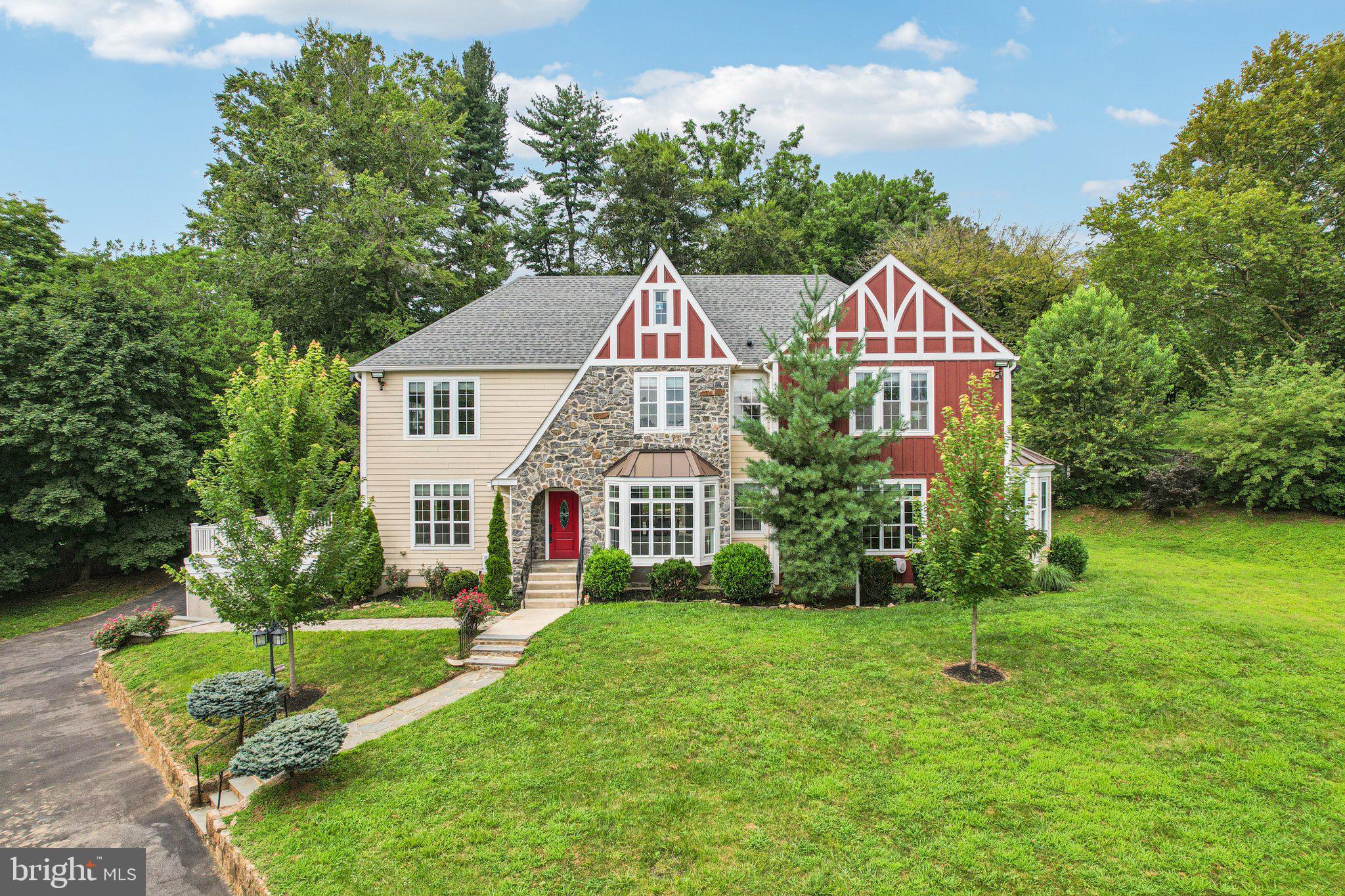 Breathtaking luxury remodel located in Radnor Township! Come experience this Tudor-style home rebuilt in 2017 that blends Main Line charm with modern upgrades, providing a rare opportunity to live in one of the area's most desirable neighborhoods. 700 S Roberts offers 5 bedrooms and 6 full bathrooms. Set on over an acre, this property features a scenic yard with a Japanese maple tree and curved stone entry. Inside, enter into a stately foyer with bay windows leading to a spacious living room with a wood-burning fireplace and large windows. Enjoy a refined dining room with an abundance of natural light that connects to a kitchen with an oversized island and all newer appliances, including a refrigerator, range hood, and high-end finishes throughout. A full bathroom is also conveniently located on the main level and another one is located in the partially finished basement. The large basement space has two separate entry points located on each end of the house with great potential to be finished and add instant equity. Upstairs, the luxurious primary suite includes a spa-like ensuite bath. Two of the secondary bedrooms have their own attached ensuite baths while the remaining two secondary bedrooms share a full hall bath, perfect for a busy household. Outside, you'll notice a spacious patio with beautiful pavers in the back and a side deck perfect for outdoor entertaining. With a long driveway featuring both an attached and detached 2-car garages, there is ample parking and storage available. Situated in the top-ranked Radnor Township School District - just minutes from Bryn Mawr’s charming downtown. Enjoy boutique shops, fine dining, and cultural landmarks like the Bryn Mawr Film Institute. With SEPTA’s Paoli/Thorndale Line, I-476, and Route 30 nearby, commuting to Philadelphia or surrounding suburbs is effortless. Nearby parks and the Radnor Trail offer endless opportunities for outdoor recreation. Schedule a tour today to experience the elegance of this Main Line gem.