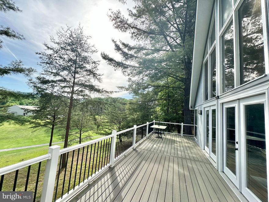 Golf course view + wooded setting + lakeside scenery + renovated, modern interior = HEAVEN!!  Located in the Woods of Hedgesville WV, this glamorous getaway is the perfect combo of the best of the best of the woods.  Walking distance to the Woods Grille and the Mountain View Pool, and yet wooded and private all at the the same time.  This UBER-modified Elmwood has at it's center, an extra-wide spiral staircase, stark and powerful against the blues of the sky through the wall of windows overlooking the greens of the course and Sylvan Lake in the distance.  Current owners spared no expense in creating the PERFECT short term rental flow with all the conveniences.  Three bedroom suites are all equipped with private ensuite euro-style baths, Updated FAB and swanky kitchen with electric oven, new cabinets and white quartz countertops. The laundry is conveniently located on the main level; tucked out of the way and behind easy-to-use barn door.  The living and dining areas are open and flow - with the graceful and modern extra-wide spiral anchoring one side and the fabulous wall of windows with the S/SE exposure to watch the sunsets.  The exterior of the house makes it a place to party - with an amazing flow from the screened in porch to the rear deck with the killer view and the hot tub and french doors that can open wide and bring that outside vibe inside to the wide open living space.  Each bedroom suite is set up for a couple to have an easy stay and privacy when needed.  Everything in the house is new or "newer." Ready for you to make it your getaway house and have a turn-key rental to pay your bills! Furnishings and contents can be sold separately.  This property currently has an A Golf Membership to the The Woods Club. (Not part of the HOA - privately-owned.) There is an $3150 initiation fee and dues are $2500 a year plus tax. There are flyers attached to this listing - ask and all attachments can be shared. You do have the option to downgrade this to a B Membership which does not include golf, just the pools and gym. That is $1450 per year. Feel free to ask about tours of the facilities. Golf, the Spa and the Club House Grille are open to the public. All of the HOA docs are attached to the listing.  Just ask and they can be shared. Staging by Honey House.