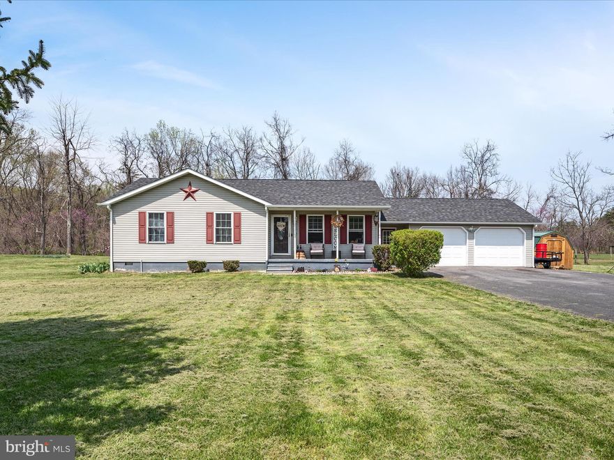 Welcome to 290 Heavenly Drive, a charming 3-bedroom 2-bath rancher in the Skyview Meadows neighborhood of Hedgesville WV. Nestled on a beautiful 1.38 acre lot,  this cozy home offers the ease of one level living. Step inside to discover a functional and inviting layout with the bedrooms tucked in the back of the house.  Both bathrooms have been beautifully upgraded to add a modern touch to the home. The spacious kitchen has been upgraded with new cabinets, quartz countertops and all new appliances under a year old.   New LVP flooring throughout the kitchen and living areas while the bedrooms are carpeted for comfort.  Outside, you'll find a large back deck perfect for cookouts and hosting gatherings.  The two car garage is finished with new insulated garage doors. The roof and windows were replaced just 18 months ago. The hot water heater and well pump are brand new. Schedule your showing today and make this move in ready home yours!