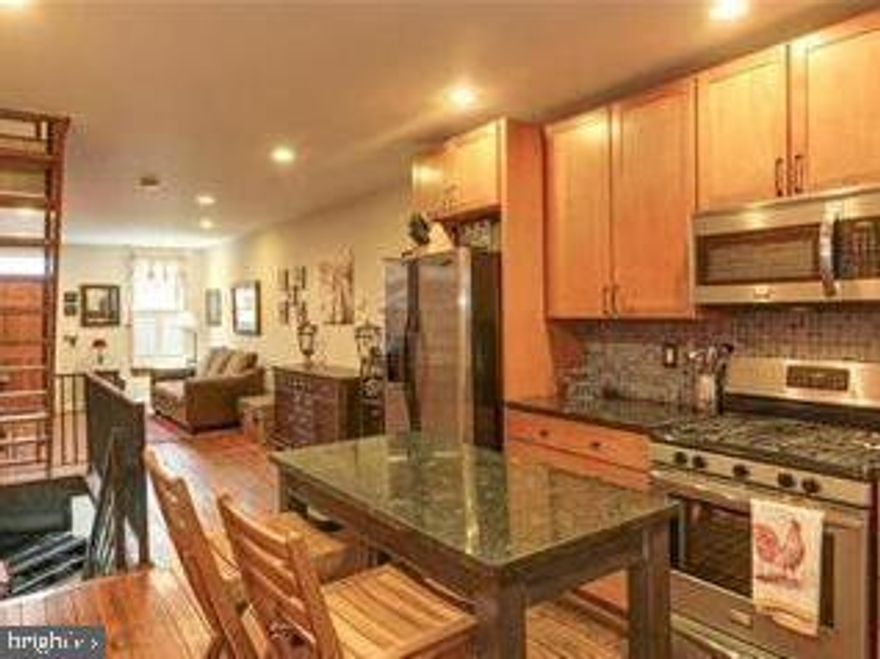 THIS IS THE ONE YOU'VE BEEN WAITING FOR! Charming, modern-industrial style home with original hardwood floors, exposed brick wall, updated kitchen & baths, 2nd level laundry, open staircase and MUCH, MUCH, MORE! Finished basement is a perfect family-room or 3rd BR. Entertain on your private courtyard or on your very own ROOFTOP DECK! Peace & quiet, yet close to everything Fed Hill has to offer. WELCOME HOME!