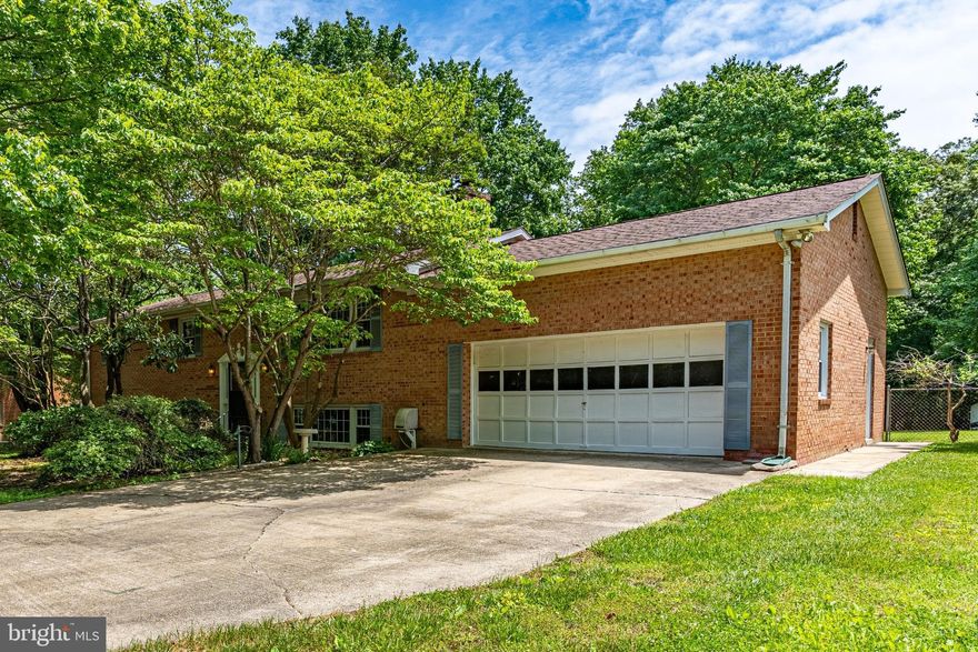 Welcome home to 44603 Joy Chapel Rd, your own peaceful retreat! There is plenty of room in this spacious split foyer with 5 bedrooms, 3 full baths, a 2 car garage, and a large rec room downstairs that features a gorgeous brick wall with a wood stove. The primary bedroom has a bright, updated en-suite bathroom. Get ready to enjoy the outdoors! You’ll have easy access from the kitchen and dining area onto the large deck and you can move right down to the expansive backyard, which includes a fire pit feature. This property sits on 1.41 acres with no HOA, a flat yard, mature landscaping, and the lot backs to trees for privacy.