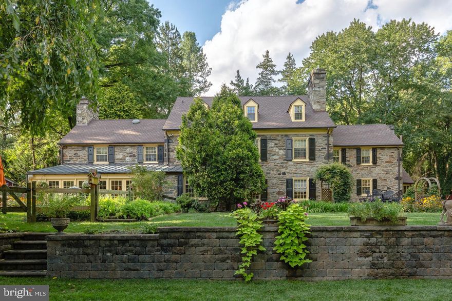 This stunning stone home is a gem, built-in 1928 by renowned Walter Durham, has been beautifully updated with today s modern features and is still filled with so much original charm and character. The finely detailed and lovingly maintained interior is filled with natural light and features gorgeous wide plank wood floors, crown moldings, 3 fireplaces and offers great spaces for living and entertaining. Outside the home offers more wonderful features including 1.5 acres of park-like grounds with beautiful landscaping, flagstone patios and paths, a newly renovated salt water, in-ground pool with a spa and a fabulous pool house.  The home is located in the heart of Penn Valley, close to Center City, shops, and restaurants in the award-winning Lower Merion School District. Inside, the home features spacious and elegant living and dining rooms, a large family room, and an updated gourmet kitchen with granite countertops, center island, custom cabinets, 2 farm sinks, and a wet bar with wine fridge. Built-in Thermador/Viking appliances include a refrigerator-freezer, double ovens, 2 dishwashers, a microwave, and warming drawer. The beautiful sunroom has wonderful views of the professionally landscaped grounds all 4 seasons and opens to the backyard, pool and stone patios with walkways and multiple sitting areas. The pool house is spectacular with a full kitchen, bathroom and living area with a vaulted ceiling, covered patio and is approximately 750 SF. The upper level features a luxurious master suite with a sitting area, generous walk-in closet, and a lavish master bath featuring a Jacuzzi tub and separate shower. The upper levels include the 5 additional bedrooms, some with en-suite baths, good closet space, a second-floor laundry room, and 2 walk-up attics. Additional features and updates include a finished basement with a recreational area, storage, and second laundry room; new roof with copper gutters and downspouts; newer heating and air conditioning systems; newer energy-efficient Pella windows; irrigation system; new pool heater and filter system; heated 2-car garage and excellent security system.