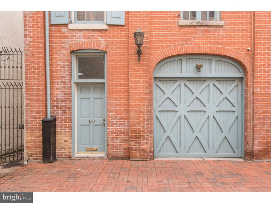 Stunning, 4bed/2.5bath, 20FT WIDE, Carriage Home in Washington Square West with GARAGE PARKING and possible 2ND PARKING SPACE(block yourself in)! Meticulously designed and maintained, this carriage home features the perfect blend of historic details and modern high end finishes.  First floor features an expansive living room with a wood-burning, refinished stone fireplace with reclaimed wood added to build shelving and custom cabinetry; a full dining room with exposed brick; and hardwood floors throughout. The updated kitchen features stainless steel appliances, custom cabinetry, exposed brick, wine fridge and wine storage area.   As you walk up to the second floor relax and enjoy the beautiful stone wall, which ends with a wine wall complete with functional library ladder. The second floor features two custom built guest bedrooms, as well as a beautiful master suite featuring fireplace and exposed beams, renovated master bath and walk in closet outfitted with California Closets system.  The sunny and well lit fourth bedroom is located on the third floor and it includes a wet bar with sink, fridge, custom cabinetry, granite counters and access to the truly amazing roof deck which was completely renovated with new pergola, seating area and exquisitely landscaped; the perfect place to entertain or enjoy the lights of the city skyline! Additional features include reclaimed wood, custom stonework/steel, custom millwork, high ceilings, unique roof deck with 360 degree views, self-watering custom rooftop landscaping, and second floor laundry.  Located in the McCall catchment, this amazing home is a short walk to all major attractions including high end shopping, award winning restaurants, Rittenhouse Square,  Washington Square, and more. Convenient access to local and regional trains, 676, 95, 76, Broad Street Line and the Philadelphia International Airport.  This home is truly one of a kind!