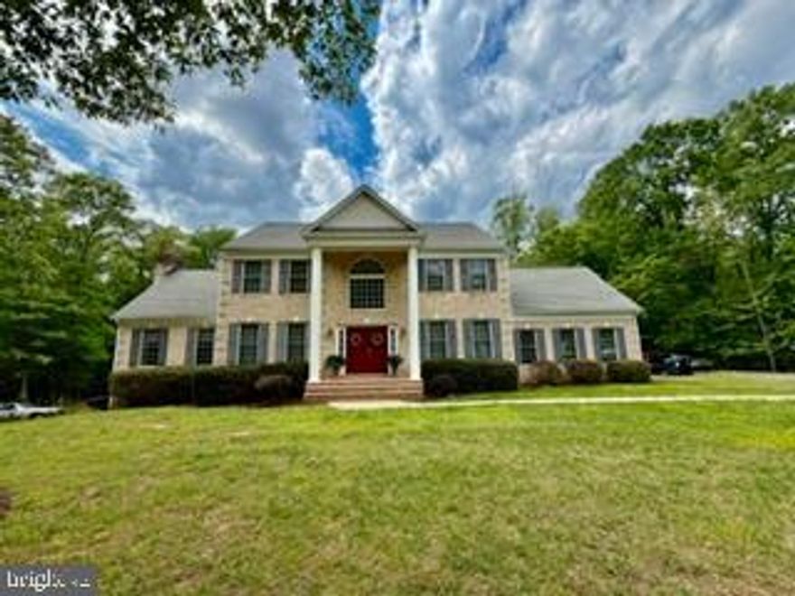 Beautiful Colonial Home being sold as is on a 4 acre lot. 
The home has 2 Masonry fireplaces with one having gas logs and the other is wood burning.  Festuring an oversize 2 car garage,  3 bedrooms, 2 full baths and half bath. Endless possibilities for the large unfinished walkout out basement.  The basement has  rough in  piping for a full bath and full size windows and doors.  Go and show