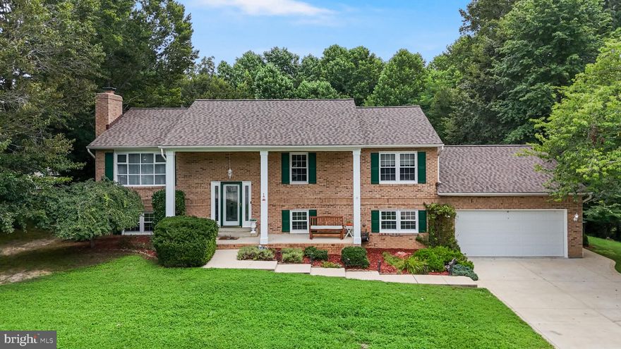 Stunning La Plata Home with Exceptional Upgrades – No HOA!

This beautifully updated La Plata gem offers two fully finished levels with 4 spacious bedrooms and a potential 5th, along with three newly remodeled bathrooms. The remodeled kitchen, featuring rich custom cherry cabinetry, stunning granite countertops, upgraded stainless steel appliances—perfect for any home chef.

Enjoy formal meals in the separate dining room, which opens to a large deck overlooking a private backyard retreat with stair access to the Jacuzzi Hot Tub brand J-355—ideal for entertaining or relaxing. New luxury vinyl plank flooring flows throughout both levels, complemented by brand-new carpet in all bedrooms.

The living room showcases the home's most striking feature: an extravagant spiral staircase that serves as a dramatic centerpiece connecting both levels. On the lower level, the spacious recreation room includes a brick wood-burning fireplace, perfect for cozy gatherings. A fourth bedroom, full bath, and a flex room currently used as a gym (easily convertible to a fifth bedroom or office) complete the space.

Additional updates include a recently replaced roof with architectural 50-year shingles, a newly redone concrete driveway designed for smoother vehicle access, and new exterior concrete walkways and pads for improved functionality. The home’s exterior has been freshly painted and power washed, with recent servicing of the HVAC system and chimney, including cap repairs. HVAC & hot water heater were also recently replaced and updated.

Conveniently located near shopping, schools, and commuter routes—with no HOA and a home warranty included for peace of mind.