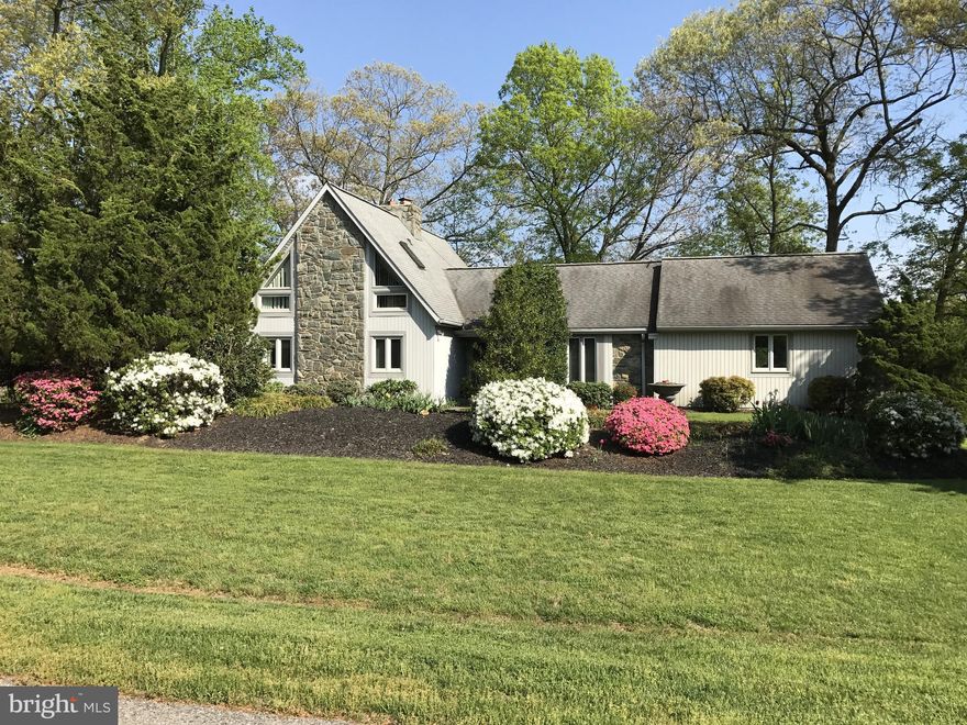 Nestled on 8 sprawling acres, this magnificent Estate is truly one of a kind! A property that offers the perfect blend of luxury and functionality. Only 20 minutes to Annapolis, 25 minutes to Washington D.C. and 35 minutes to Baltimore. Country living secluded and peaceful, yet minutes from all amenities and many major highways. This exclusive community of custom homes, each situated on over 2 acres, exudes a sense of serenity and privacy in a very tranquil neighborhood. Boasting two spacious primary suites and one additional large bedroom, 5 1/2 baths, 4 step-in closets, and two gourmet eat-in kitchens, complete with granite countertops, stainless steel appliances (including a Jenn-Air cooktop & a double wall oven), tile floors & abundant cabinetry. Four additional rooms offer a rich mahogany decorator wood paneled home office, a spacious loft/multipurpose room complete with full private bath and large closet, a 2nd home office with full bath and step-in closet, and a thoughtfully designed gathering room providing easy access to the numerous patios, decks and pathways. The open floor plan flows seamlessly, from the breathtaking great room with  a soaring stone fireplace & hardwood floors, to the gorgeous formal dining room with custom moldings and more hardwood flooring. This home is designed for grand entertaining. Ten double French doors frame the entire back of the home, allowing you an endless portrait of each season's beauty, while two wood burning inserts offer cozy, or romantic winter evenings with their warm glow. This gorgeous property is a horse lover's dream, a gentlemen farmer's paradise or a homesteader's haven. Featuring 8 12x12 stalls, this concrete block & oak board stable includes a separate, yet attached tool shed. Paved & gravel driveways lead to 4 gated & fenced lush pastures and two run-in sheds. Five well fed hydrants are conveniently located about the property. A stream fed pond flows thru three pastures enhancing the picturesque landscape. This Crown Jewel Estate offers ample space for riding & relaxation with numerous flagstone pathways, terraces and two levels of spacious decking! Exquisite & extensive landscaping provide continuous perennial color throughout the seasons. A bubbling waterfall pond and dramatic gazebo add the finishing touches to your entertaining areas. Timeless elegance combined with modern convenience makes this a rare find for the discerning buyers seeking an idyllic countryside retreat.