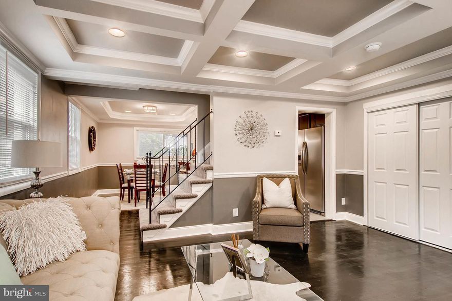 Welcome home. Stunning renovation located in well maintained accessible location. This contemporary style home has inverted ceilings, hardwood floors, a custom kitchen, and a fully finished basement with 2 full baths and off street parking. You don't want to miss this one. It won't last.