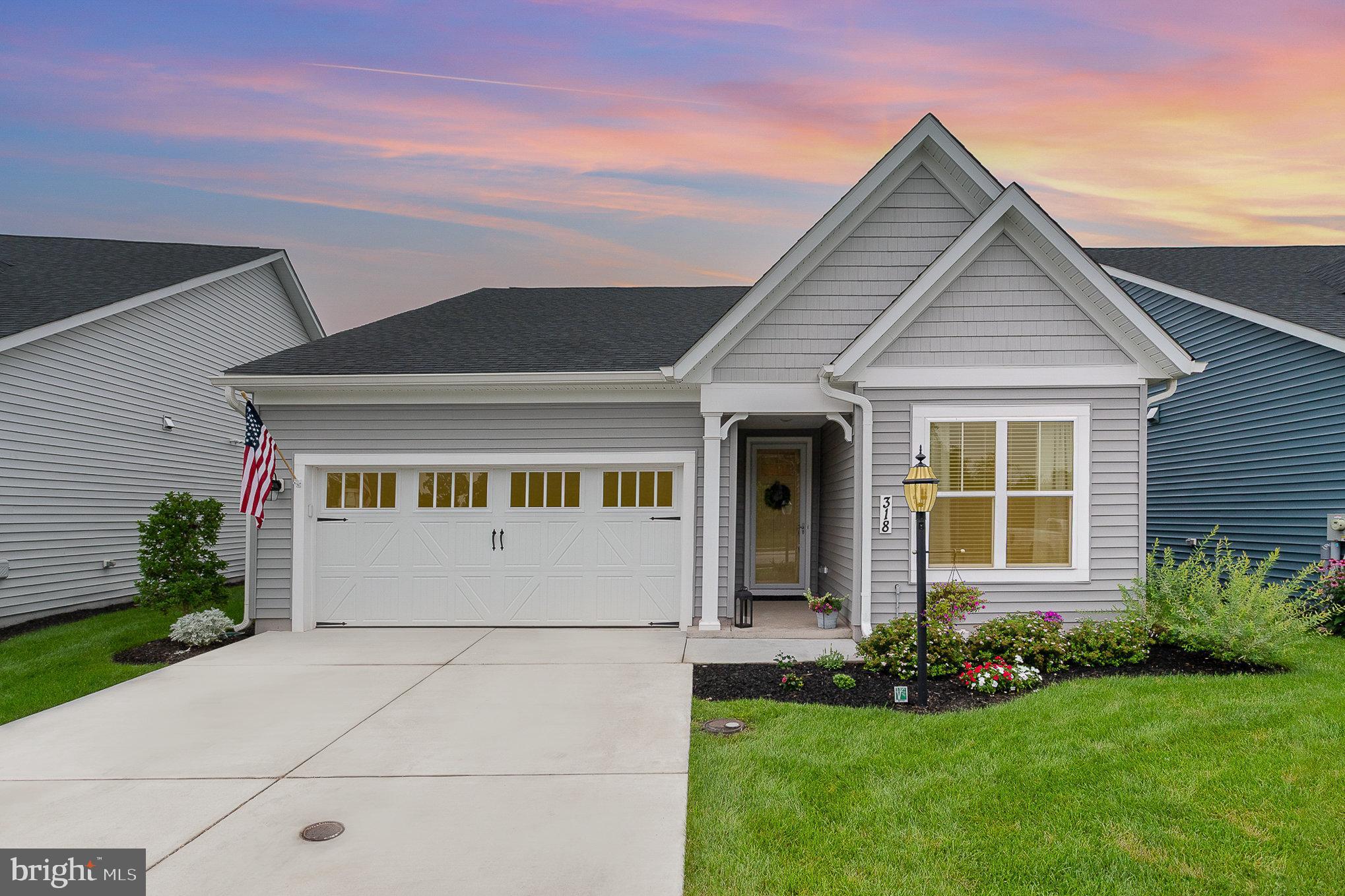 Welcome to your new home at 318 Rustic Wood Drive. You will enjoy one-level living, in this Kellaway Model with 1908+ sq ft of living space. The home is located in Amblebrook, which is a 55 and older, state of the art community in Gettysburg Pa with lots of amenities. Enjoy the indoor pool/ hot tub and large outdoor heated pools. A Clubhouse for meeting with neighbors and lots of planned activities and clubs to enjoy. See movies in our theater, create in the art room and cooking classes in the community kitchen. The gym and pickle ball courts will be great for exercising as well as our walking paths. Golf carts are allowed for fun traveling to your events. This beautiful, like new, upgraded home features, 9 ft Ceilings, two-bedrooms, 2 bath, plus a den/flex room and was just built in 2023 by Caruso Homes. The grand kitchen has White upgraded cabinets, and a farmhouse sink in the large island with room for 4 stools. Sellers installed a White Subway Tile Backsplash. There are SS Appliances and a nice walk in size pantry. The grand living room makes it easy for entertaining while enjoying the gas fireplace. Trey Ceiling, fans, blinds, rods and draperies are all included. The primary bedroom is spacious, with a accent wall. The en suite bathroom has a large double vanity and walk-in tiled shower. The guest suite has a bath right outside and is on the opposite side of the home. The flooring is Upgraded LVP and throughout the home. You will love the Ship lap as extra accents in different places. The patio off the back is a great space and there are extra pavers in garage to make it even bigger. The home has a water softener. The garage has a coated painted floor and shelving for extra storage. Community garden plots are across the street. Amblebrook's HOA covers your grass mowing, snow removal and mulching the front flower beds. This home wouldn't last long. Come take a tour, you will be in love with your next home.