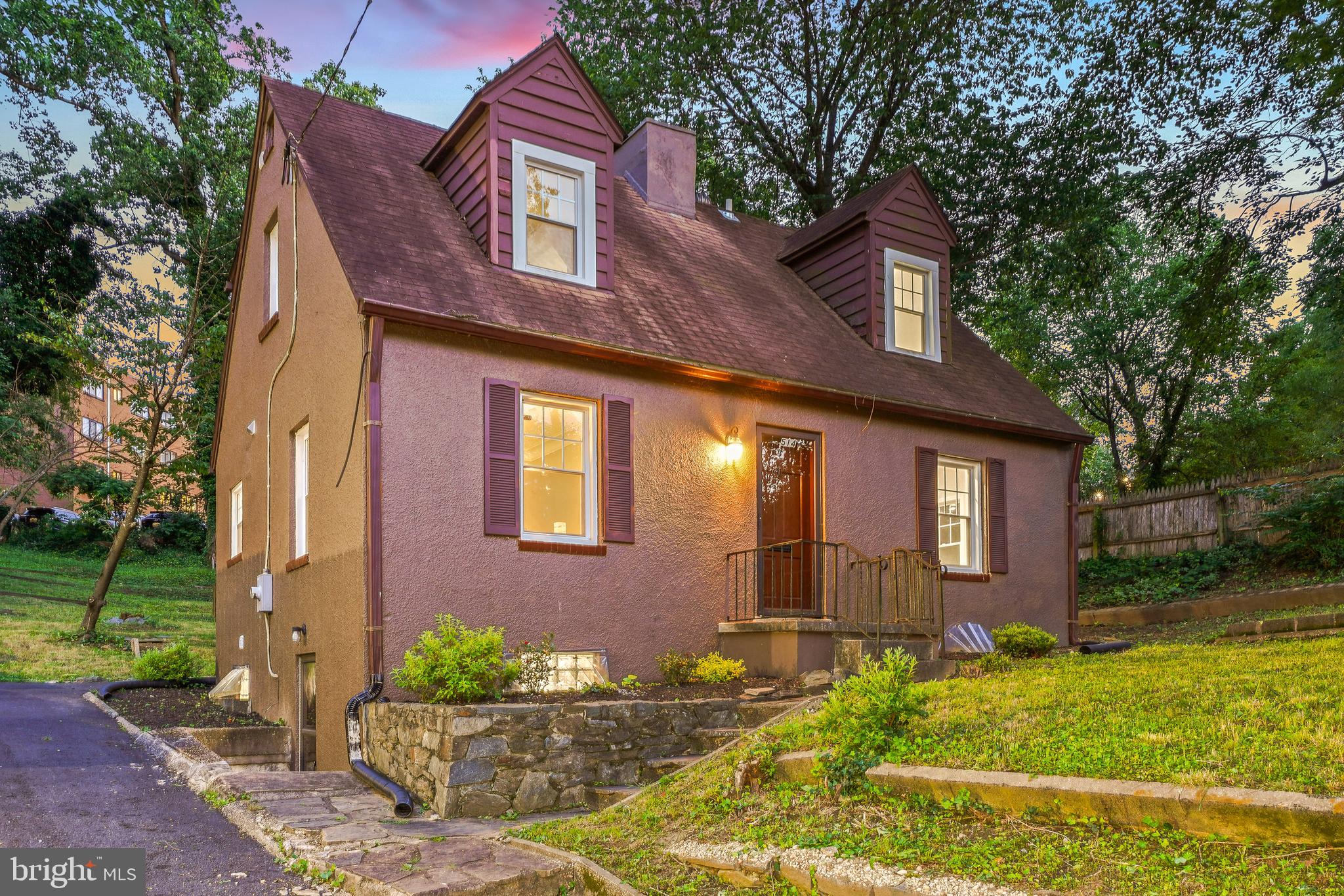 Updated Top to Bottom—Simply Move In! This charming home offers sun-filled rooms, rich hardwood floors, stylishly redesigned bathrooms, replacement windows, and a standout quartz kitchen—all spread across three finished levels of living space on an impressive 11,730-square-foot lot.
The inviting living and dining room combination features recessed lighting, a fireplace, and French doors leading to the new rear deck. Adjacent to the living room, the bright chef’s kitchen is thoughtfully designed with exquisite quartz countertops, Samsung stainless steel appliances (with a Maytag dishwasher), soft-close cabinetry, a gas range with a built-in griddle, and 12-inch tile flooring. The kitchen sink overlooks scenic views of the backyard and deck.
The main level includes an inviting bedroom or office with crown molding and a convenient powder room. Upstairs, you’ll find two generously sized bedrooms, two renovated full baths, and a charming landing area. The primary bedroom features wood flooring, dual closets, and a private en-suite bath with a walk-in shower.
The finished lower level provides flexible living space, including a family room / fourth bedroom with tile flooring and overhead lighting, a bonus room with a wet bar, a beautifully appointed bathroom, and a laundry area. The basement includes a mini kitchenette, bathroom, and separate entrance—making it ideal as a rental unit or an in-law apartment.
Perched on a hill, the home sits on a deep lot featuring an expansive backyard, a deck for entertaining, a shed for additional storage, and a private driveway. The outdoor space offers a tranquil retreat with plenty of room to play, entertain, and unwind.
Located in the Blair neighborhood of Silver Spring, this home offers the perfect blend of peaceful residential living and urban convenience. Enjoy a welcoming community atmosphere with easy access to Sligo Creek Trails, community parks, shopping, dining, and entertainment in both Downtown Silver Spring and Takoma Park. Just 1.0 mile from the Takoma Metro Station and close to multiple bus lines. 514 Silver Spring Avenue is a completely renovated Cape Cod just steps from parks, trails, schools, restaurants, shops and transit!