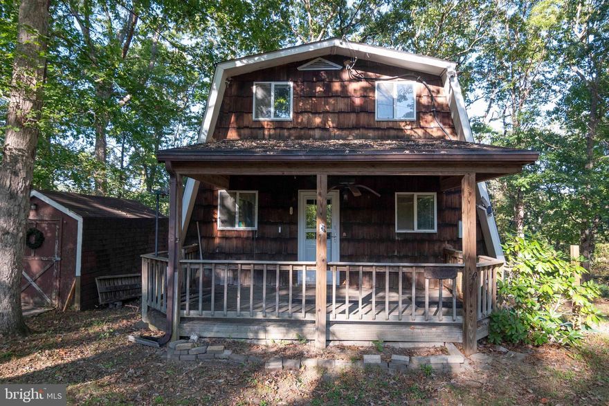 NEW PRICE!  Full-time living or weekend getaway on 2.21 acres—opportunity awaits! This fixer-upper/handyman special offers unlimited possibilities. While being sold as-is, the property includes several recent improvements such as a new roof (2023), hot water heater (2024), and well pump (2020). There’s also a generator hookup for added convenience. Enjoy plenty of outdoor space with a covered front porch and rear deck, perfect for relaxing or entertaining. Located in Shenandoah Farms, residents enjoy access to multiple recreational amenities including the Riverview Boat Landing on the Shenandoah River, Farms River Road Rec Lot, Lake of the Clouds, Spring Lake, Treasure Island, and a community center. The property is within a Sanitary District, with fees conveniently paid through real estate taxes, and Covenants and Restrictions apply. The main level offers a living room, dining area, kitchen, two bedrooms, and one full bath. The upper level features a large family room, one bedroom, and one full bath. The full, unfinished walk-out basement includes laundry with a washer and dryer, a woodstove that conveys, and potential for future living space. High-speed internet is available. Conveniently located just minutes from I-66, hiking, wineries, restaurants, and downtown Front Royal, this property offers endless potential for those seeking a peaceful retreat or full-time home in a scenic setting.  No health department records on file