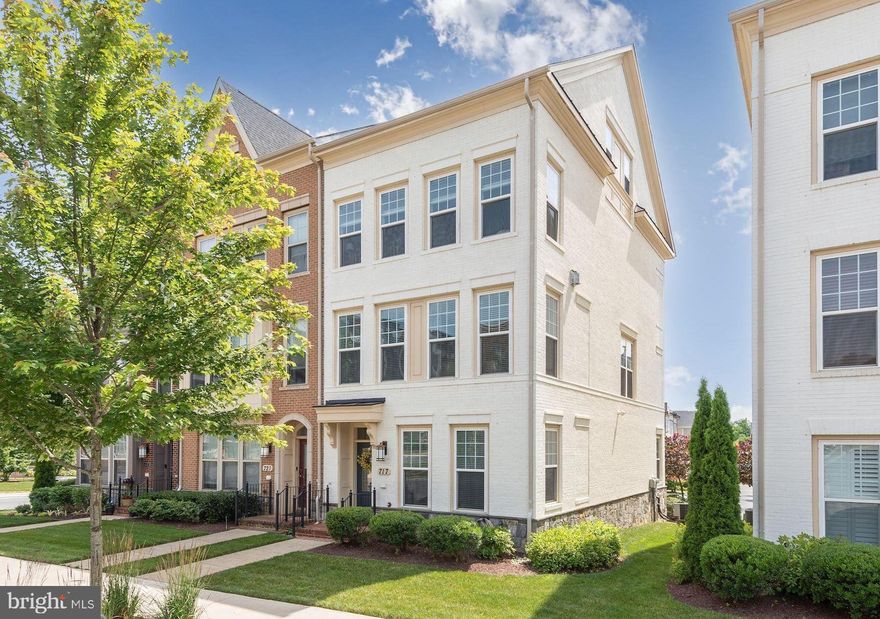 Welcome to 717 Hendrix Avenue! This incredible end-unit 4-Level townhome in the Crown West section of the Crown community was newly built in 2013. Perfectly situated near The Retreat (the community club house, pool, and tennis court), this stylish home shows beautifully with a generous floor plan and lovely finishes. 717 Hendrix Avenue is a 3 Bedroom and 2.5 Bath townhome that spans approximately, 2,259 SF. Complete with an open concept main level, an incredible Rooftop Deck, and a bonus Entry Level Den, this residence is wonderfully designed and move-in ready. 

The Main Level begins with a bright Living Room that is accented by large windows and a Gas Fireplace with a granite surround and handsome mantle. The Dining Room is adjacent to the Kitchen and Breakfast Area. The Gourmet Kitchen is well-appointed with granite counters, stainless steel appliances, gas cooking, a spacious center island and an adjoining Breakfast Area. There is access to the Rear Deck from the Breakfast Area. A Powder Room is also on this level.

There are 3 Bedrooms and 2 Full Baths on the First Upper Level, including a gorgeous Primary Bedroom encompassing an En-Suite Bath, a huge walk-in closet and a secondary closet. The Primary bath has a double sink and an oversized shower. The Laundry is located on the Bedroom Level for convenience. The Second Level is dedicated to a spectacular Family Room featuring a built-in wet bar/entertainment center. French doors open to the enviable Rooftop Terrace that offer sweeping views of the community. The Entry Level hosts an open Den/Bonus Space, the Foyer, and access to the attached 2-Car Garage.

Crown is one of the newer developments in the Gaithersburg area that has brought an exciting blend of retail, restaurants, and residential living together. Downtown Crown is the main retail and entertainment hub, while 3 additional communities encompass stunning townhomes, single family homes, condos, and apartments. The Crown amenities are located at The Retreat, a massive complex that boasts an outdoor pool, expansive sun deck, lounge areas, an outdoor fireplace, and even a rock-climbing wall. 717 Hendrix Avenue is located in Crown West where the Poet’s Walk, a centralized path through Crown West, leads residents to Downtown Crown. Lined with red brick and manicured trees, this walk is a beautiful feature enjoyed by many residents. There are 2 parks in Crown West – City Park, a 5-acre green space, and Steinbeck Park, a peaceful place to gather or relax.