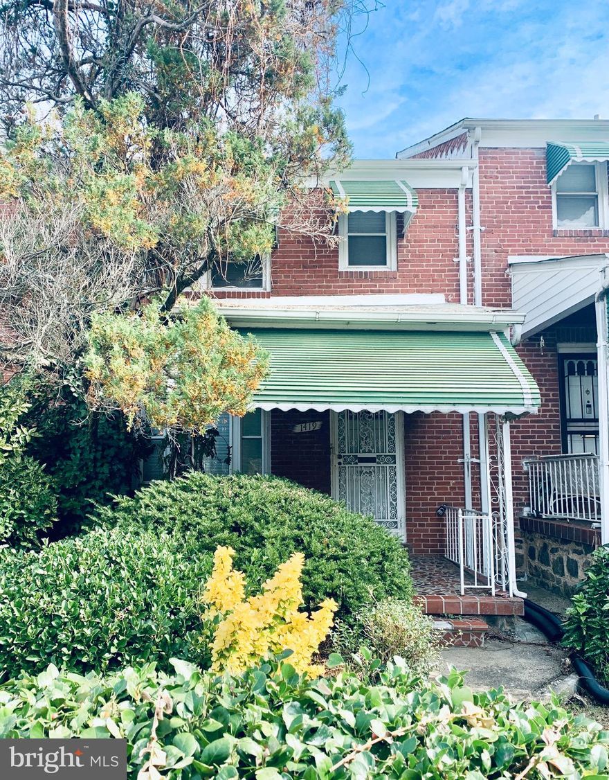 This adorable row home is the perfect opportunity for a first time home buyer or savvy investor! Beautiful outdoor spaces. The covered and spacious front porch, back  porch, patio, and fenced-in yard make entertaining easy! Hardwood floors throughout!! Upstairs bedrooms are large and share the hall bath. Walk-out basement needs work, but has lots of potential with existing full bathroom and space for a 4th bedroom. Sump pump less than 4 years old.  
Plenty of parking. Clean and spacious alley.  School adjacent. 
Sold As-is.