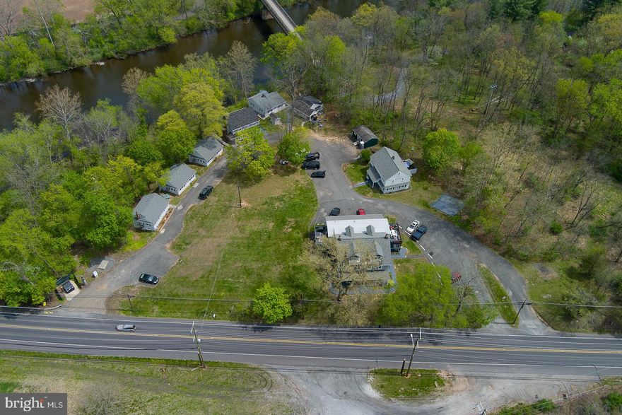 Welcome to Perkiomen Creek Village - a cluster of cottage homes and apartments located on the banks of the Perkiomen Creek offering a 7.16 CAP Rate! This enclave consists of 12 units within 8 buildings situated on 2.81 acres. This highly desirable and popular village is 100% leased and is sought after by potential tenants who enjoy the the Perkiomen Trail, either on foot or on the water, and those familiar with Perkiomen Valley Schools located just across Gravel Pike. The complex consists of 6 singles, a Twin/Duplex and a 4 unit main House. All units are separately metered with 100 amp electric, Gas heat & Hot water(1 unit has oil heat & 4 units have electric Hot water) . The 6 Single homes were all totally Renovated in 2023 with finishes that include Granite Counters, S/S Appliances, new cabinets, LVP flooring & new HVAC w/ C/A. Both Twin/Duplex units  were repainted and LVP installed (June 2025). All units include a Washer, Dryer, Dishwasher, Gas Range and Refrigerator. All Cottages, Waterfront House, and Twin/Duplex have private basements. Quad has a shared basement.  All units are Public Sewer and On-Site well water.
Highly desirable rental community, always a waiting list, with private access to the Perkiomen Trail. Conveniently Located across From PV High School with school district bus pickup in front of the property. There is so much more than just cap rates to consider with this opportunity, many of the units are still rented below market rents! As Rents continue to reach market rent, rents have increased by $20,000/yr in the last 6 months of 2025! With these new leases setting a precedent for rents within the community, an additional $18,900/yr is expected in 2026. Minimal deferred maintenance required.