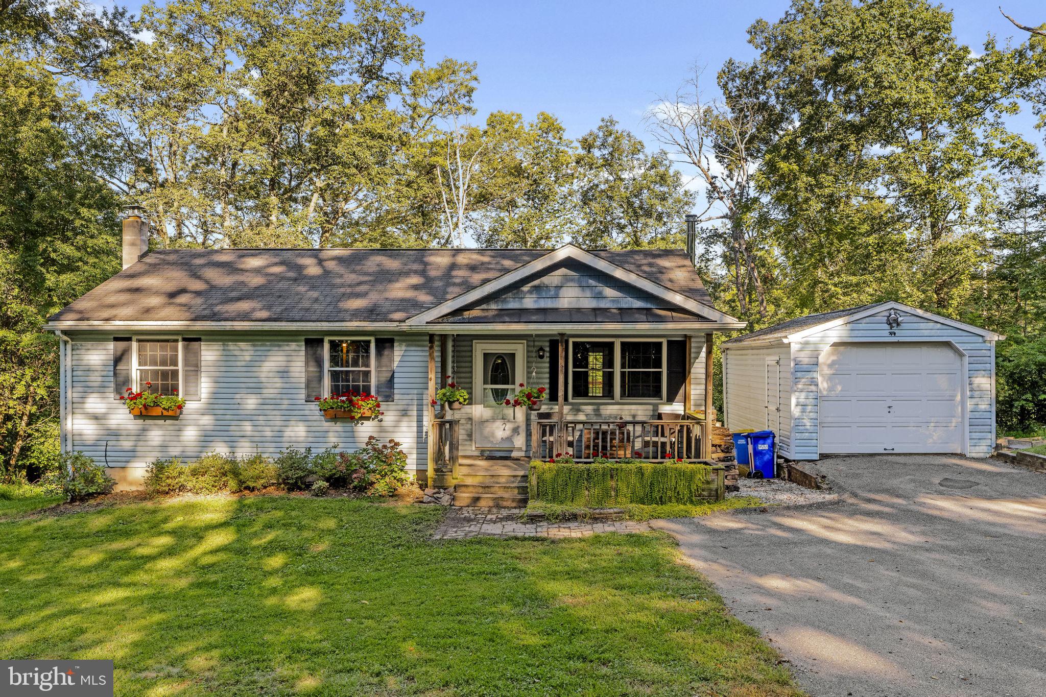 Charming ranch-style home on a private 1-acre lot in Stewartstown! Features 3 main-level bedrooms, 1 full bath, and a finished basement with a large 28x21 family room, additional bedroom, and half bath. Enjoy a covered front porch, spacious back deck, detached 1-car garage, and shed. Surrounded by trees with a gently sloped backyard-ideal for relaxing or entertaining. All this just a short drive to Shaw Orchards, Allegro Winery, Stewartstown Railroad, and local parks-plus easy access to I-83 for commuting to York, Harrisburg, or Baltimore. Peaceful country living with room to grow!