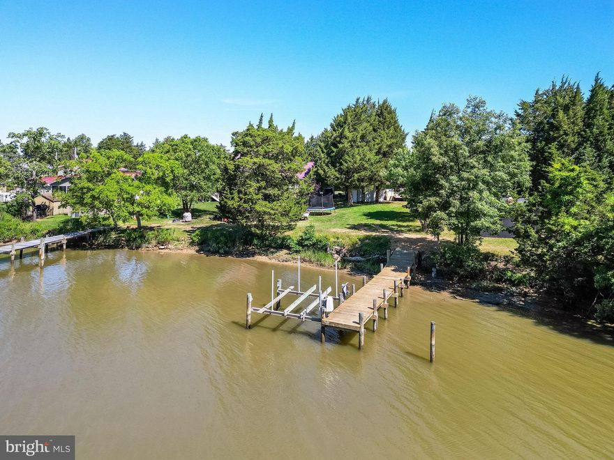 This charming, waterfront cottage could be just what you are looking for! This home has been meticulously maintained to include 3 new roofs, Pavilion, shed & main home.   The pavilion has ideal visibility on the new pier, Mill Creek & the mouth of the Potomac River. Perfect for crab feasts or family outings.  inside offers  3 great size bedrooms, big enough to fit queen-sized beds and one nice size updated bathroom, new flooring and much more!. This waterfront property will not last long!