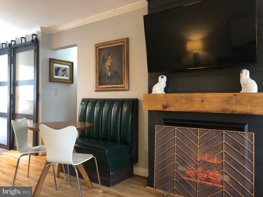 Gorgeously updated 1 bed 1 bath condo in Potowmack Crossing! Enjoy one level living with no steps to this beautiful home.  An updated kitchen with subway tile, granite countertops, stainless appliances and storage galore will keep the everyday cook or aspiring chef busy! A designer's dream, this home features custom trim, electric fireplace with rustic wood mantle, washer and dryer (great barn door keeps this space private!), living room, spacious bedroom with huge closet, custom lighting, paint and more!  Available now, you will love living just minutes to GW Parkway - one light to DC, close to Old Town, the Mount Vernon Trail, Reagan National Airport, Del Ray and Amazon HQ2 - this location cannot be beat!