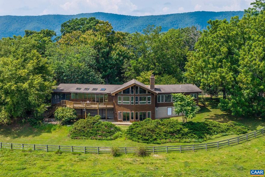 Welcome to Willardville, a one-of-a-kind Virginia farm with special history and potential. Once owned by beloved television personality Willard Scott, this 240-acre cattle and equestrian estate in Raphine is a rare offering in the Shenandoah Valley. Rolling pastures, wide-open skies, and mountain views create an inspiring backdrop for both country living and income opportunities. The custom log home spans 2,400 square feet with two bedrooms and two and a half baths. Crafted in hardwood, it features open spaces, abundant windows, and rustic elegance that blends with its surroundings. Complementing the main residence are five outbuildings. A barn includes a two-bedroom, one-bath barndominium apartment with a kitchen. A cozy one-bedroom, one-bath cabin with living room space adds charm, while two studio cottages provide self-contained living. The two-story spring house features a kitchen and living room on the main level with a bedroom and bath upstairs. All are in excellent condition with updates, offering strong potential as rentals or guest accommodations. Ideally located between Lexington and Staunton with easy access to I-81, Willardville provides both seclusion and accessibility in a truly unmatched rural setting.