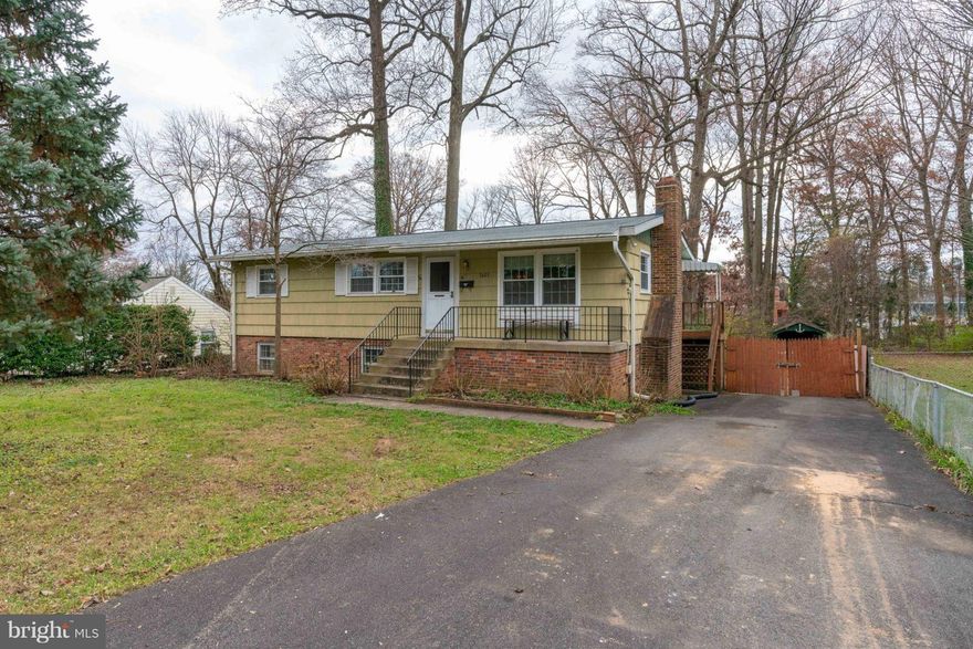 A Bargain for Do It Yourself Buyers! This home on almost half an acre is in need of some TLC and a coat of paint, but it's priced accordingly! Main Level with Hardwood Flooring, Large Living Room, Eat-In Kitchen, Master Bedroom w/Half Bath, Built-in Dresser/Cabinets.  Fully Finished Lower Level with Rec Room, Custom Wet Bar, 2 Den/Bedrooms, Full Bath, Separate Laundry, Fireplace with Wood Stove Insert, and Walk-Out to Back Yard. The Large, Level Back Yard is Fenced and has a Patio and several Out Buildings. Brand New Roof and Replaced Main Level Windows.  Conveniently located inside the Beltway with easy access to major routes. This home is strictly being sold "As Is".