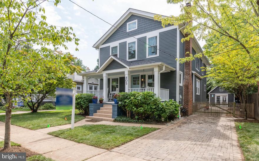 Welcome to 405 East Luray Avenue! This charming 6-bedroom, 4-bathroom home is located in the fabulous Del Ray neighborhood of Alexandria, and was completely renovated in 2016. Originally a small bungalow, this spectacularly sunlit home now boasts nearly 3300 square feet of finished living space, with four bedrooms and two bathrooms upstairs, including a large master suite with walk-in closet and gorgeous marble tile in the bathroom. The main level welcomes you with original charm and a wood-burning fireplace, but quickly presents a marvelous open floor plan with Thermador gas range, quartz counters, a splendid kitchen island and gorgeous tile backsplash, built-in storage, a dedicated breakfast nook, and also a formal dining area. Also on the main level is bedroom and full bath, which allows for one level living, a space for overnight guests, or the perfect work from home space! The lower level has been completely finished and provides an additional bedroom/office and full bathroom, along with a large walk-in pantry, built-in wet bar and surround sound speakers in the ceiling. It is the perfect rec room, or virtual school zone! There is also a detached garage with electricity, fully fenced-in backyard, and stone driveway. Additional bonus details, include custom window trim throughout which was made to match the original home with the new, and even an electric vehicle charging station is already installed. Less than a 10-minute walk to Braddock Road Metro, and only a few steps to all of the shops, restaurants, and markets that make Del Ray great. This is a special opportunity, and will not last long! Virtual Tour: https://mls.immoviewer.com/portal/tour/2003294?psm.showBottomLine=false&accessKey=5f88&psm.showPoweredBy=false&psm.showShare=false