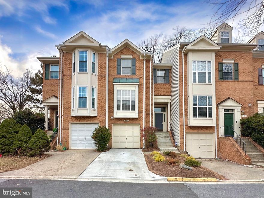 Offer deadline - Wednesday, January 21st, at 4 pm. Welcome to 13402 Silver Moon Way, a beautifully maintained brick front 4 level townhome in the desirable Nottingham Woods community. The covered front entry leads to the welcoming two story foyer, which opens to the living room - this level features hardwood flooring. A wall of windows fills the two-story living room with natural light, and glass french doors lead to a spacious deck. A separate dining area overlooks the living room from above, framed by railings on two sides for an open-concept feel. The eat-in kitchen, off the dining area, features recessed lighting, 42’ cabinetry, a pantry, ceramic tile flooring, and a box bay window at the table space, adding more natural light.
The stairwell leading to the bedroom level is brightened by a two story ceiling and a skylight. Vaulted ceilings, a walk in California Closet, and a large picture window with a window seat overlooking the back yard enhance the primary bedroom. The primary bathroom has a dual sink vanity, vaulted ceilings, LVP flooring, and a ceramic tile tub/shower surround. This level also features 2 additional bedrooms, both with California Closets, a second full bathroom with LVP flooring and a ceramic tile tub/shower surround, and a large linen closet in the hallway.
The lower level features a powder room and access to the garage with shelving for extra storage. The second lower level features a large recreation room, a wood burning fireplace, a storage closet with a sump pump, and a laundry room.
Great location! Walking distance to the Colesville Shopping Center, short drive to local parks, and quick access to the ICC (200), Route 29, and I-495 for commuters. 
The roof is approximately 5 years old, hot water heater was replaced in 2024, HVAC system in 2015, main sewer line in 2024, and a new driveway in 2024.