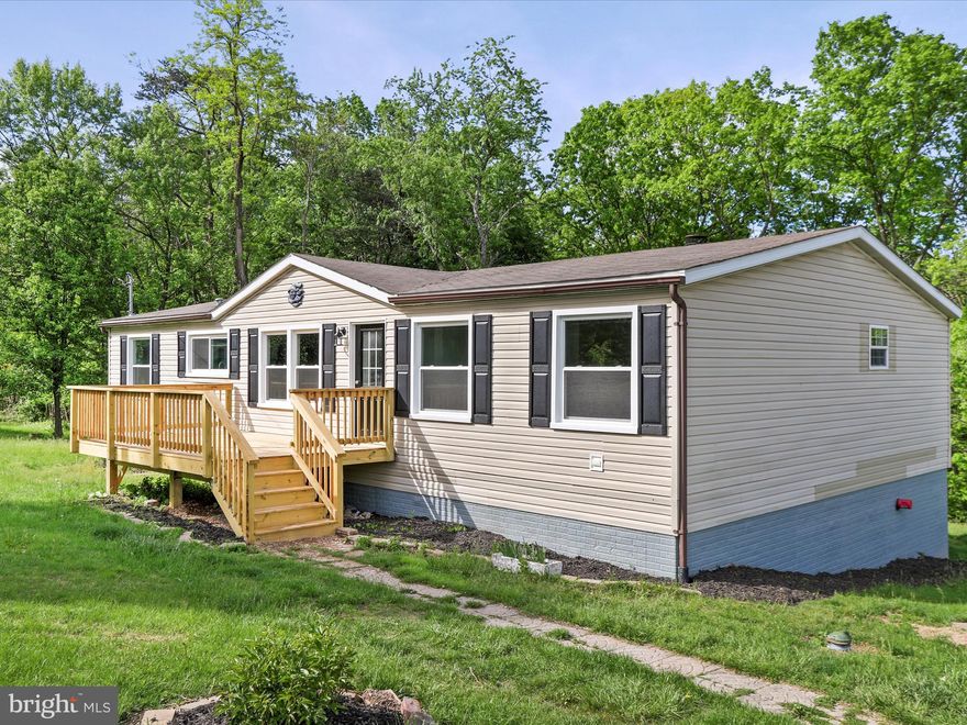 Newly updated and spacious 3 bedroom, 2 bathroom home in unrestricted land with a full walk out basement and backyard privacy!  This home features a new kitchen with shaker cabinets, quartz countertops, and stainless steel appliances.  New LVP flooring, updated lighting and fresh paint throughout!  New decks on the front and back.  Some new and updated windows.  Plenty of space to put up a garage or nice shop!  Check it out today!