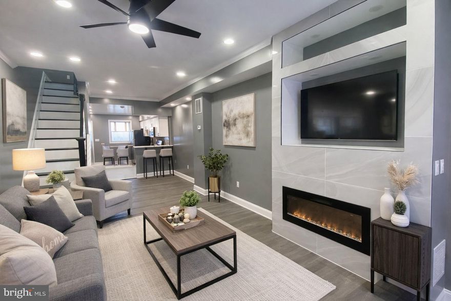 This fully renovated 2-bedroom, 2-bath home offers modern city living with a thoughtfully designed open-concept layout and high-end finishes throughout. The main living area is bright and inviting, featuring recessed lighting, luxury plank flooring, and a sleek electric fireplace, all new appliances including washer & dryer with a contemporary tile surround—ideal for both everyday living and entertaining.

The kitchen blends style and functionality with crisp white shaker cabinetry, quartz countertops, a designer tile backsplash, and stainless steel appliances, including a gas range. A deep stainless steel sink with matte black fixtures and ample cabinet space enhance both efficiency and visual appeal.

Both bedrooms are well-proportioned, while the two full bathrooms showcase modern fixtures and clean, timeless finishes. Neutral designer paint tones and updated lighting continue throughout the home, creating a cohesive and move-in-ready aesthetic.

Located in a vibrant city neighborhood, this property offers convenient access to major commuter routes, public transportation, and nearby amenities including dining, shopping, and entertainment. Its efficient layout and durable finishes make it an excellent opportunity for first-time buyers, urban professionals, or investors seeking strong rental appeal.

A turnkey property that combines modern design, functionality, and prime city convenience.