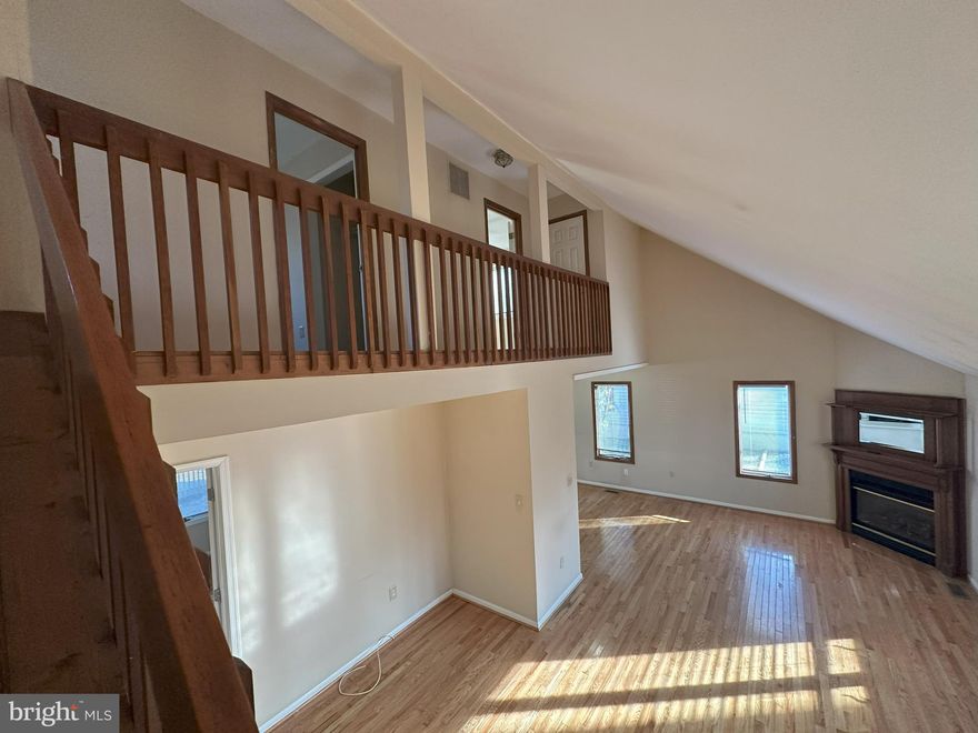 This two story cedar cape is larger than it looks.   Main level bedroom with connecting bath and balcony overlooking back yard.  Two additional bedrooms on the catwalk upstairs.  Contemporary with hardwood floors, gas fireplace and vaulted ceilings.  Fenced rear yard for privacy. Storage Shed. Community access to private swimming and picnic area.  Members only boat ramp.