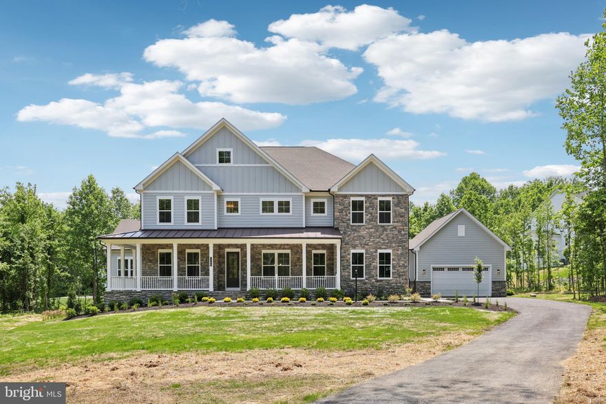 MAIN LEVEL SUITE WITH PRIVATE ENTRANCE. The Preston by D.R. Horton EMERALD is 7,868 total square feet and includes 6 bedrooms, 7.5 baths and 4-car garage nestled in a wooded haven. The contemporary exterior features a partial stone front, covered porch and hardi-plank siding. Enter the foyer with formal dining room and a flex room to use as you prefer opposite of each other. Convenience at its best the dining room includes a butler pantry with added cabinets for storage and beverage center. 10 foot ceilings grace the main living space with tray ceilings and beamed ceilings in the formal dining room, family room and kitchen areas. The kitchen, family room and casual dining space provide the open concept feel. Cozy next to a gas 60" linear fireplace and enjoy wooded views. The kitchen is fit for a chef and includes our "Pro-Kitchen" upgrades to include a Kitchen Aid 48" counter depth refrigerator, 2 dishwashers, 36" commercial grade range, with second convection oven/microwave combo. The kitchen island is over-sized with an abundance of seating. An additional room off the kitchen is perfect for a catering room or office space. Enjoy the wooded views from the tall double slider in the family room. A drop zone, double door coat closet and walk-in pantry is positioned conveniently at the owner-entry. A GENEROUS main level bedroom is positioned with walk-in closet and full bathroom. The main level bedroom includes its own dedicated living room space and its own private entrance, and private washer dryer. An open oak staircase leads to the bedroom level. Enter the primary bedroom at the top of the stairs that features a sitting area along with tray ceilings. The elegant primary bath is breathtaking. A dual head glass enclosed shower is the focus point with free-standing tub in front.  Tile in all baths have been selected by our design team. Sinks with an abundance of storage is positioned opposite of one another. Plenty of storage is included with a dual walk-in closet and separate linen closet. 4 additional sizable bedrooms are on the upper level, each with own baths and an abundance of closet space. The bedroom level also includes a study with its own private bath. For convenience, the laundry room is on the upper level with cabinets and sink included. Two storage closets and linen closet complete the bedroom level. A generous recreation room, bedroom and full bath complete the basement. Enjoy our Home is Connected package which includes a skybell with video camera, Echo Dot, z-wave thermostat, z-way light switch and z-wave door lock with deadbolt. Welcome to your new home!