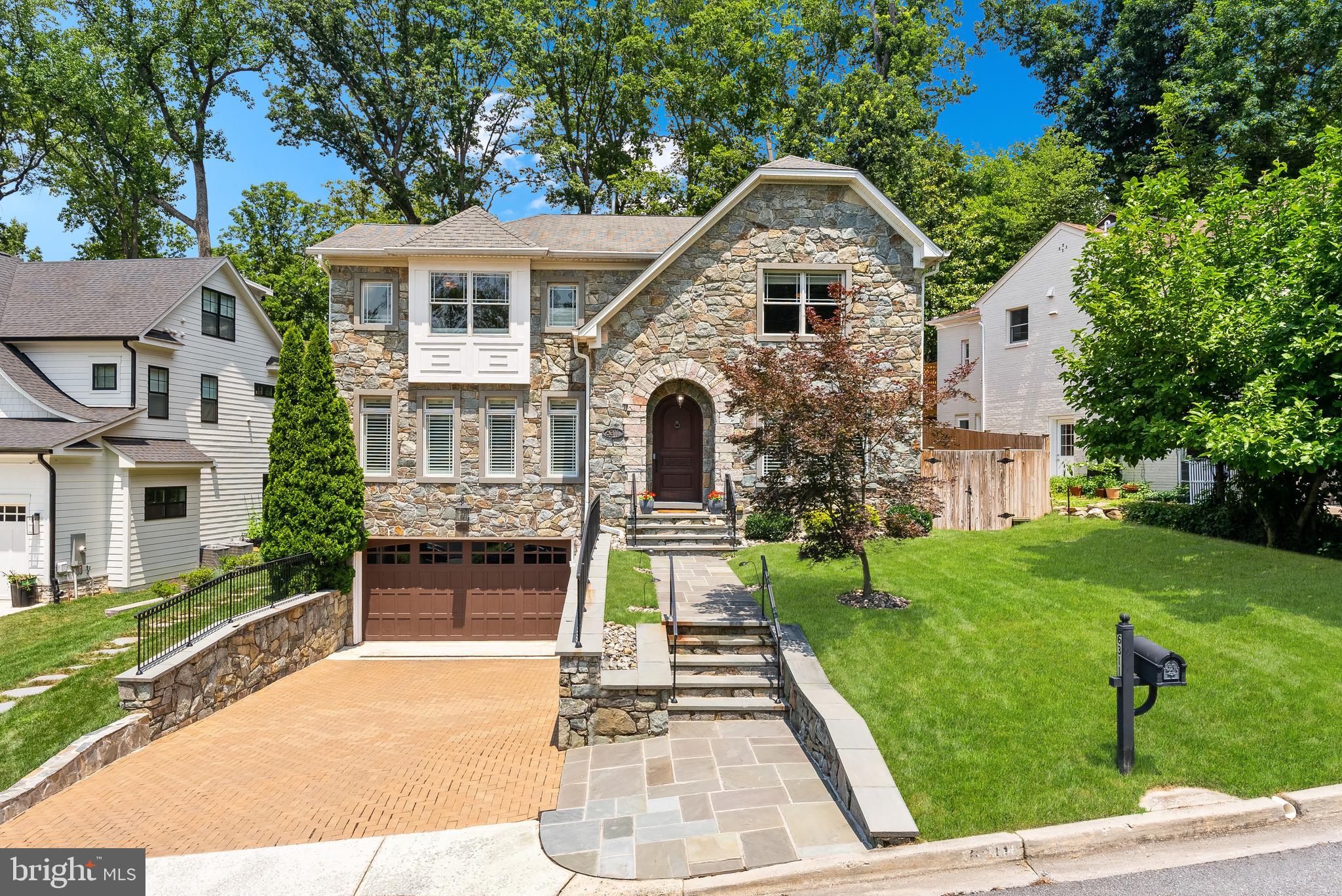 Tucked away on a quiet, tree-lined street in the Woodhaven neighborhood of Bethesda, this beautifully crafted residence by Rembrandt Homes offers timeless architecture, refined finishes, and a spacious, light-filled layout. Built in 2007 and meticulously maintained, this 6,100 SF home boasts 5 Bedrooms and 4.5 Bathrooms on 3 levels. The main level impresses with 9-foot ceilings, elegant formal spaces, and an open-concept Kitchen that seamlessly flows into the Family Room and Breakfast Area—perfect for both everyday living and entertainment. French doors lead to a private, walkout rear patio and professionally landscaped garden, creating a tranquil indoor-outdoor retreat. Past the kitchen pantry is the formal Dining Room with wet bar, as well as the Living Room/Office.
A full-service elevator provides access to all levels. The Second level features 4 bedrooms, 3 baths, and a laundry room. The spacious primary suite features a spa-like bath with soaking tub, walk-in shower, two vanities, and generous walk-in closets. The lower level includes the recreation room, exercise room, fifth bedroom/den, mudroom, full bath, and additional storage rooms.
Other highlights include a 2-car garage with a private driveway, EV Charging, and a speaker system throughout. 6311 Alcott Road is close to The Landon School, Hillmead Park, the Burning Tree Club, Kenwood Country Club, Suburban Hospital, and Downtown Bethesda. Zoned for Woodhaven ES, Pyle MS, and Whitman HS.