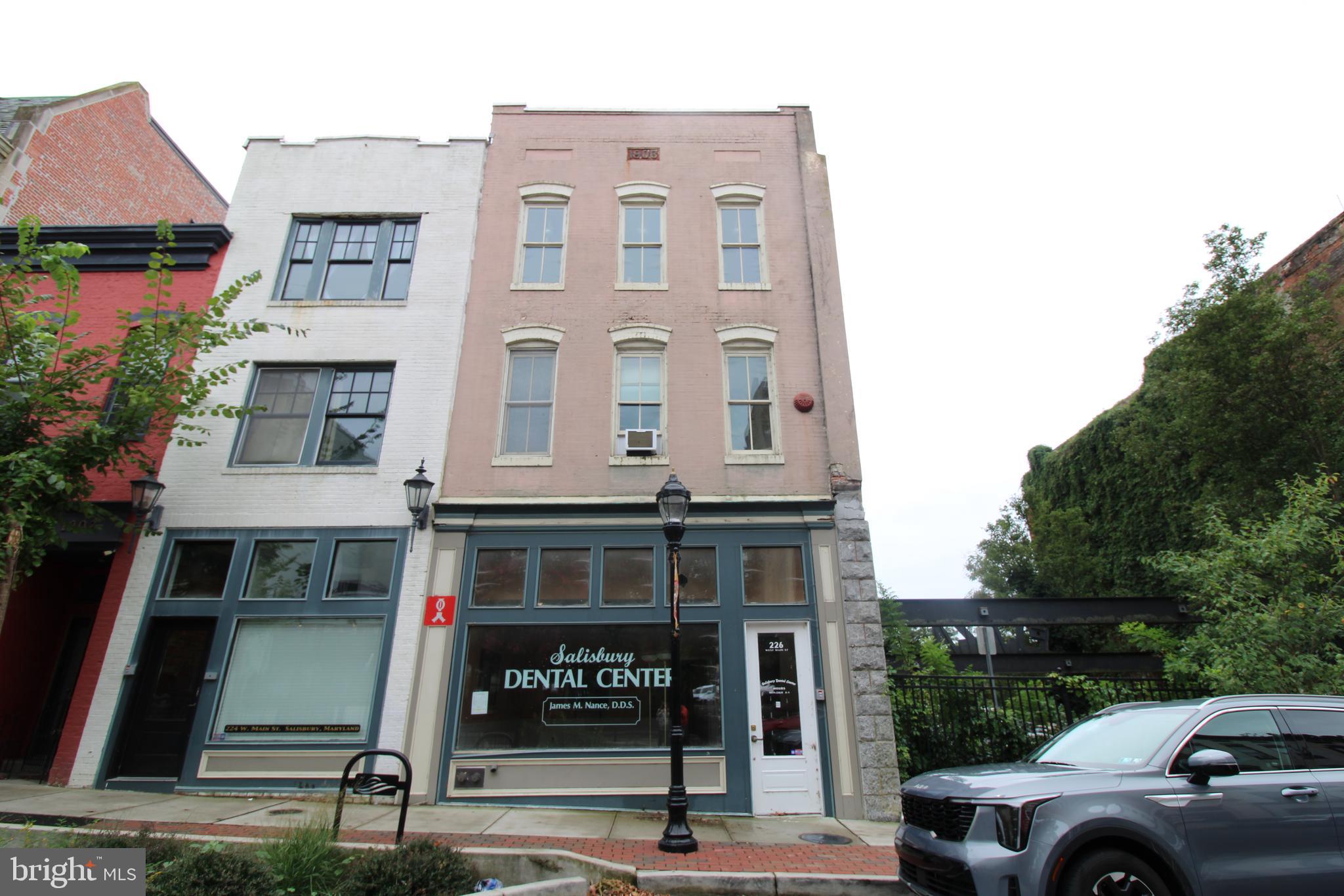 Corner unit, storefront located in downtown Salisbury, MD. The landlord has done some cosmetic improvements. This can be used as a professional office or just as easily be converted to retail.
There are 9 exam rooms with sinks and 3 rooms dedicated for private office space with two additional rooms towards the back for storage or other creative uses. There’s a basement that is recommended for storage only at this time but capable of being converted and utilized at a different capacity. Parking is located at the garage near Mogan's Oyster House or the parking lot behind Roadie Joe's along rt 50 and the main parking is coming back to public use in the near future.