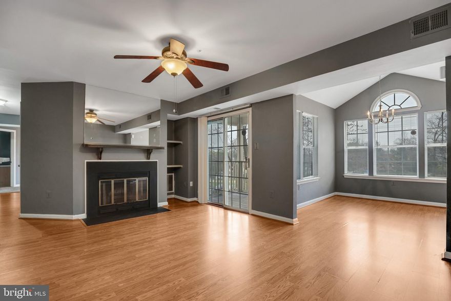 Welcome to this 2 bed 2 bath unit in Rosecroft Commons! Walk into a light and bright foyer with wood floors flowing through out the main living spaces. Living room includes cozy wood fireplace, cooling ceiling fan and sliding glass door to private balcony. Easily entertain the dining room with vaulted ceiling, center chandelier and oversized windows.  The kitchen provides plenty of counter space and cabinet spaces as well as stainless steel appliances and a pantry. Laundry room off of the kitchen provides additional storage. Retreat to the primary bedroom with bay window, plush carpeting, walk in closet and en-suite. The second bedroom includes plush carpeting and 2 closets.  It is conveniently located close to the Capital Beltway, shopping, restaurants, public transportation, National Harbor, and Washington DC. and much more! You do not want to miss this one!