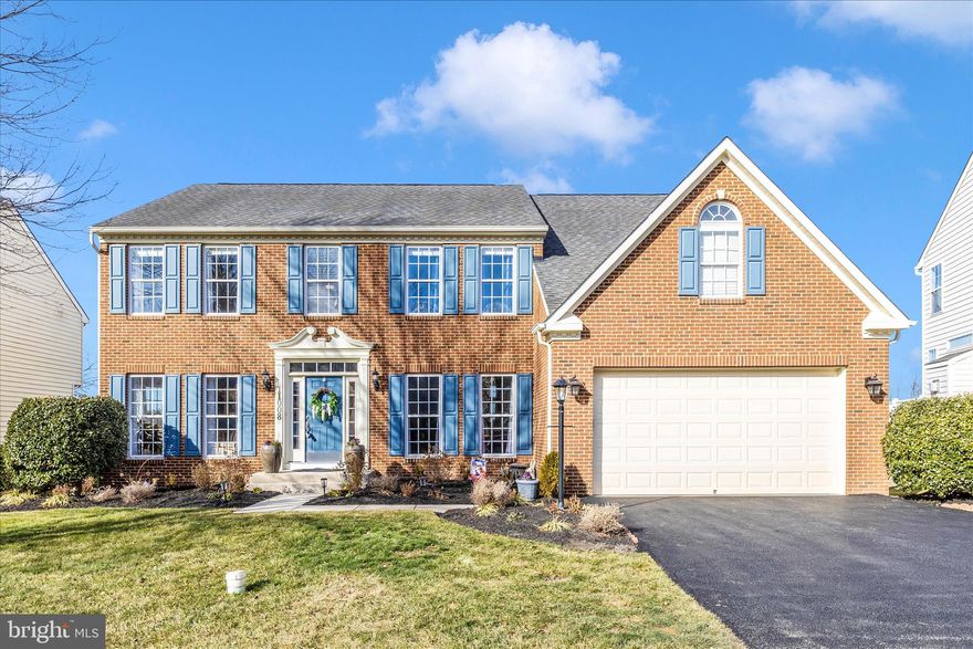 ***Welcome to this STATELY & ELEGANT BEAUTY***IMMACULATE & GENTLY LIVED IN, this SUNLIT brick home enjoys almost 5000 square feet of LUXURY LIVING on 3 FINSHED LEVELS***Located in the lovely WESTWINDS Village of AMENITY RICH LAKE LINGANORE & only a short drive to DOWNTOWN FREDERICK***This beautiful home offers exceptional space, style and comfort! Oversized windows & vaulted ceilings flood the interior with natural light, creating an open and inviting atmosphere through out! At the heart of the home, a DRAMATIC DUAL STAIRCASE connects the Kitchen and two-story Foyer, adding elegance & convenience to the layout! The UPDATED GOURMET Kitchen is designed for both everyday living & entertaining, featuring a large center island with seating, abundant counter & cabinet space, a generous walk-in pantry, granite counter tops & stainless-steel appliances including a built-in microwave, gas cook top and double wall ovens!  On the main level, an expansive GREAT ROOM enjoys a gas fireplace, vaulted ceilings, an oversized arch window and a balcony above!  Step onto the large custom deck to enjoy sweeping sunset views framed by a serene line of trees - an ideal setting for gatherings or quiet evenings.  A Living Room, Separate Dining Room, Large Office, Laundry & Powder Room complete the main Level! Fully finished basement with huge recreation room, walk out & full bath! Two rooms are set up as bedrooms & can be used for office, exercise or playroom space! One of the 4 community pools is right down the street! 4 Lakes, 2 Sandy Beaches, Volleyball, Pickleball, 35+ miles of trails, Basketball courts, Community Events including Summer Concert Series, Fallfest, Holiday gatherings, Trivia and so much more! EXPERIENCE THE ULTIMATE LAKE LINGANORE LIFESTYLE!