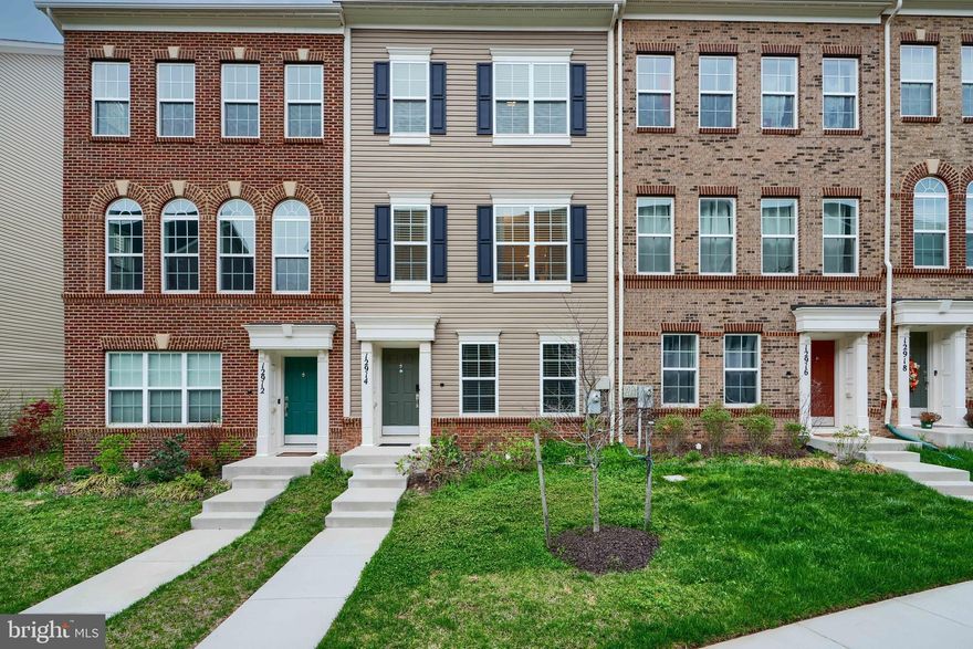 Welcome to 12914 Rustic Rock Lane in the beautiful Brickyard Station community. This home was built in 2019, offers three levels of living and a two car garage! The main level features an en suite bedroom with an attached bath. The first upper level has an open floor plan, a spacious kitchen with stainless steel appliances and a large island, formal dining room and living room on opposite sides, perfect for entertaining. There's a half bath on this level and access to a deck through sliding glass doors off the rear of the home. On the second upper level, the rear facing owner's suite offers a walk-in closet and an ensuite bath with a double vanity, walk-in shower with a seat, and a nice sized soaking tub. A second full hall bath serves the additional large bedroom, which also features a walk-in closet, ensuring ample storage. This home offers everything you'd need for modern living and set within a vibrant community. The community includes access to a large outdoor community pool, as well as a community center / clubhouse. The community center includes a large living room / tv space as well as a fully functional kitchen. There's also a private GYM that includes all the modern equipment needed for a good workout. There are two playgrounds as well as a walking path around the neighborhood that offer up to a mile for those who want to get in their steps. Don't miss out on this home, make an appointment today!