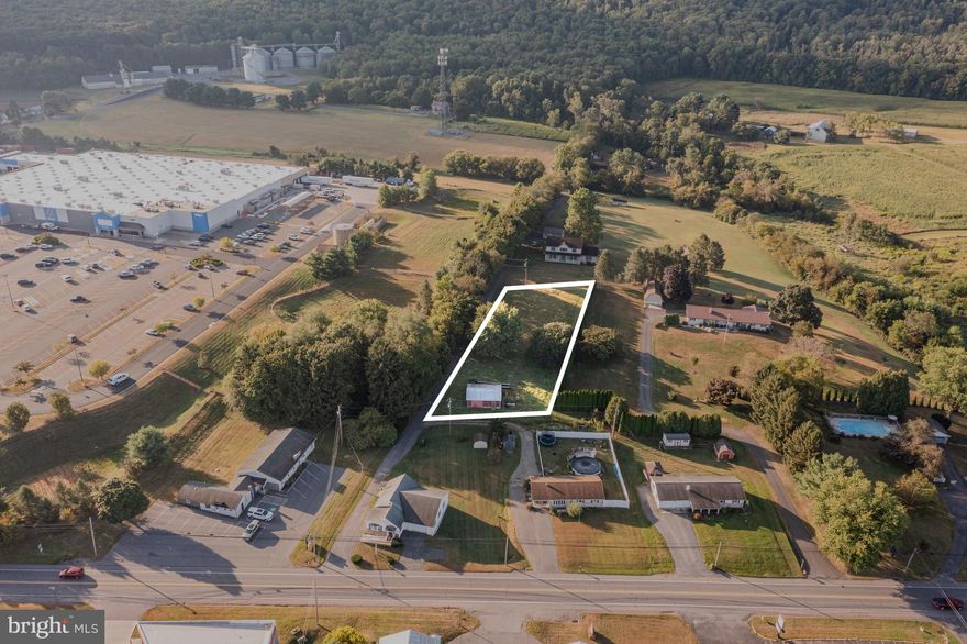 Positioned just outside of town yet close to local amenities, this level lot offers flexibility and opportunity in a convenient location. Zoned Light Industrial in Washington Township, the property includes a 20x30 barn and is well-suited for a variety of permitted uses.

Buyers are strongly encouraged to contact Washington Township directly to confirm allowable uses and building requirements.

Whether you're exploring a mixed-use opportunity or looking for space for a small business, this property delivers location, utility, and potential.