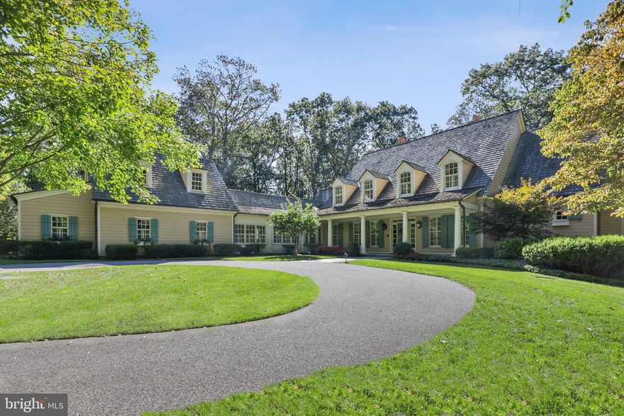 From the pages of Southern Living! Custom built by GYC Builders, designed by Jeff Penza of Penza Bailey Architects. An inviting veranda with classic columns leads to a 2-story Foyer with gracious staircase. Formal Living Room with fireplace and French doors to Sunroom with heated bluestone floor. Formal Dining Room. Family Room with fireplace flows to the gourmet Kitchen with top appliances, granite and vaulted breakfast area. A sunny back hall leads to Office, Laundry Room and Garage. Sumptuous main level Primary Suite with 2 Dressing Rooms and marble spa Bath. 4 large 2nd Floor Bedrooms, 1 fitted out as a home office with fireplace plus a large bonus room with large cedar closet and bath rough-in. Incredible Lower Level includes Rec Room with fireplace and wet bar, Exercise Room, full Bath, Wine Room and indoor resistance Pool. Fine finishes and built-ins, birch hardwood flooring, geo-thermal HVAC. Bluestone terrace, heated 3-car Garage and landscaped/partially wooded 4.39 acres in the Residences at Caves Valley.