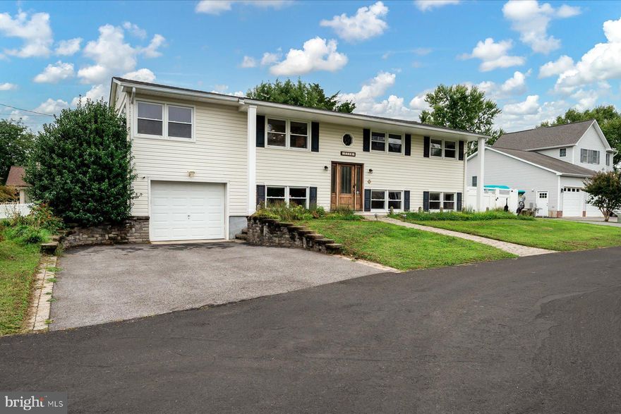 Nestled in the one-of-a-kind, desirable waterfront community of Turkey Point, this four-bedroom, two-bathroom home is situated on a spacious corner lot with seasonal water views. The layout features a dining room, living room, and two optional family rooms, offering versatile living spaces to suit your needs. The primary suite boasts an updated en suite bathroom, ensuring both comfort and privacy. Recent upgrades include an enhanced kitchen, heating system, refrigerator, and pool pump, filter, and equipment. A sizable laundry room provides ample storage, while the attached garage, equipped with an electric car charger that can convey, adds modern convenience.

The backyard is a tranquil retreat, showcasing an impressive variety of fruit trees—apples, pears, cherries, plums, and apricots—complemented by vibrant seasonal flora. The newly fenced yard, large back deck, and two driveways further enhance the outdoor experience.

Living in this unique waterfront community provides access to an array of activities, including fishing, crabbing, kayaking, or swimming at the community’s shared spaces. Residents can enjoy scenic water access, private beaches, a new playground, a recently constructed pier, and a dedicated Terrapin & Horseshoe Crab Sanctuary, making it a haven for nature lovers. Conveniently located near nature parks, wildlife areas, dining options, and marinas, this property perfectly combines serene coastal living with easy access to modern amenities.