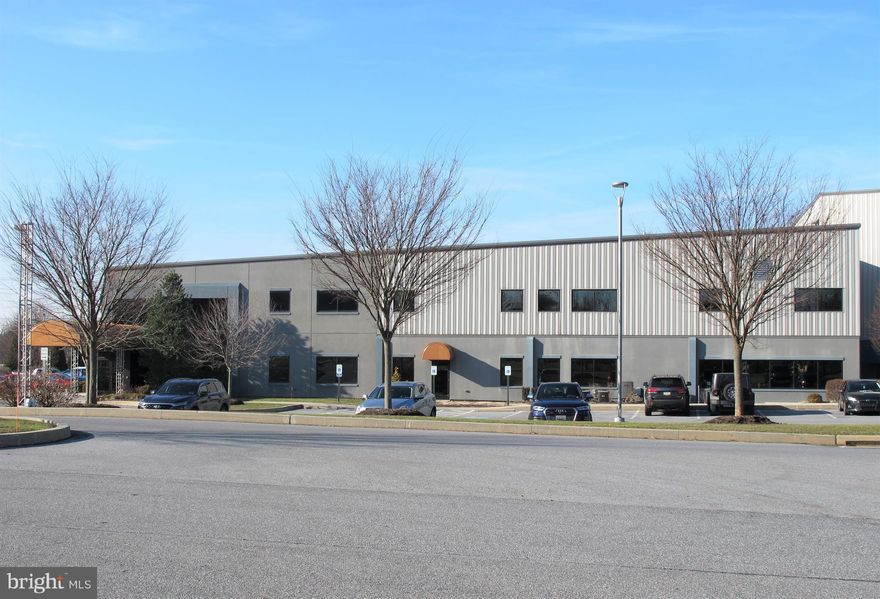 Class A warehouse/manufacturing building with ceiling heights from 20-36'.  3-4,000 SF mezzanines are bonus storage.  All but 2,500 SF is A/C.  Non A/C part has large exhaust fans and louvers.  10,000 SF Class A office.  A second story can be added over office in the future for second story growth.  The extra three or four acres can be used to double the size of the current building, be sold off or have an additional building built.