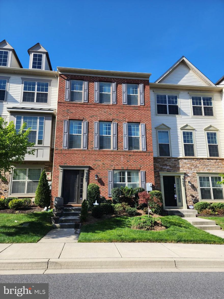 Meticiculous maintained makes this townhome move-in ready and waiting for you to claim it!  Nestled on a quiet side street in the desirable Woodmore Towne Centre community.  This townhome has 4 bedrooms, 3.5 baths, hardwood floors on all levels, ceramic tile floors in all bathrooms, and plush carpet in upper bedrooms.  The 4th bedroom in basement has hardwood floors.  It has a gourmet kitchen with island, granite countertops with backsplash, upgraded light fixtures and sink faucets, kitchen cabinetry has crown molding, and a large pantry.  The kitchen is equipped with stainless steel appliances with a gas stove, microwave, and refrigerator has side-by-side panel doors with water/ice dispenser and ice maker in lower level freezer including a touch screen. The primary bedroom has a walk-in closet with tray ceilings.  The laundry room is located on the upper level.  All window treatments have plantation wood shutters.  The home has a 2-garage.  The dining room has sliding glass door leading to balcony.  Basement is above ground so you can enjoy the sunlight.  It's the perfect home in a fantastic location.