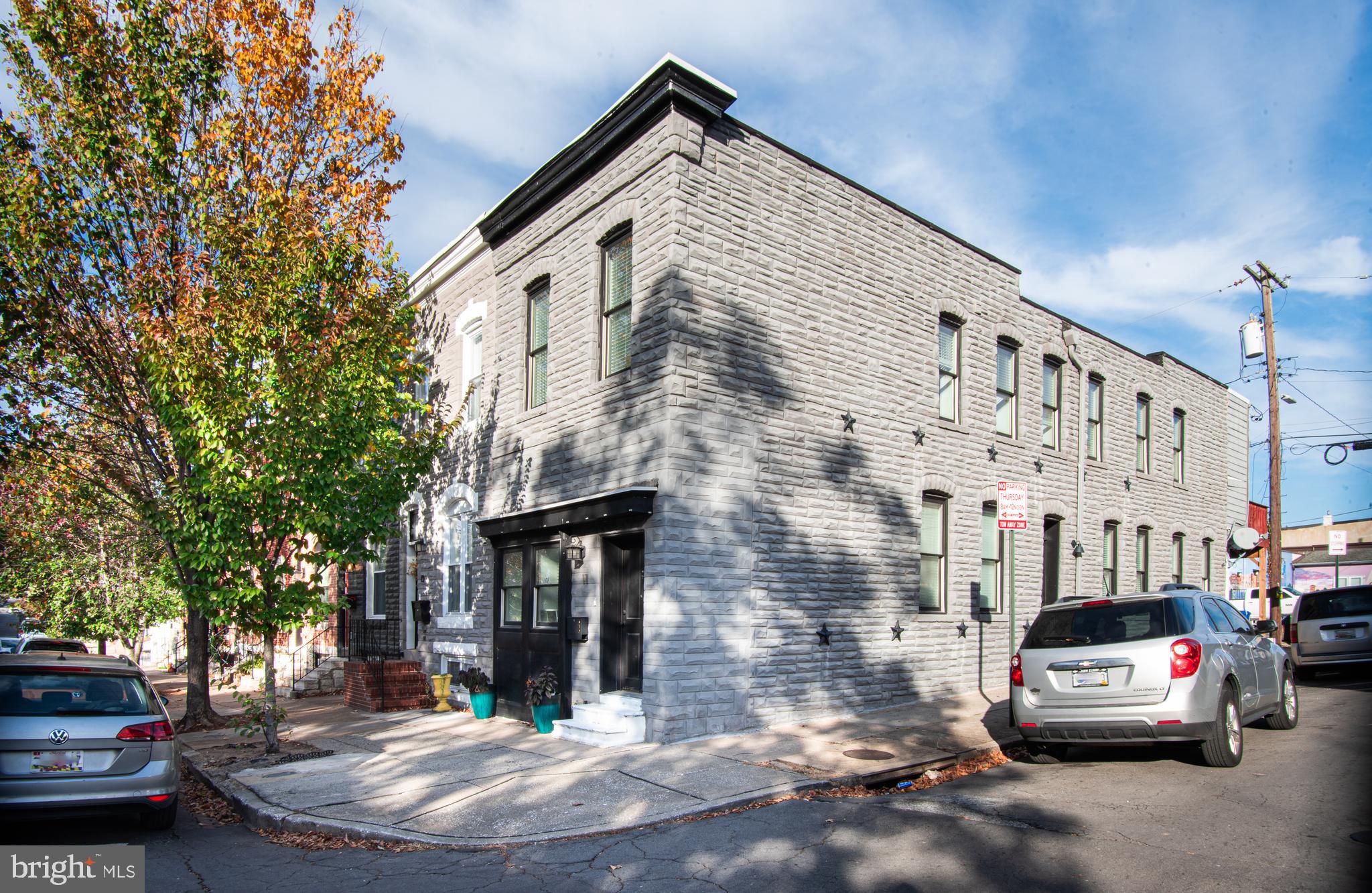 This updated corner rowhome with a private parking pad is close to Patterson Park, the Highlandtown Arts and Entertainment District, Johns Hopkins Hospital, and so much more. Centrally located to explore other areas of the city, and only a few miles from either I-95 or I-83. The main level has an inviting open floor plan with plenty of natural light, a large living room, separate dining area, and kitchen with an island and stainless appliances. The upper level has a primary suite which includes a private deck, walk-in closet, and an attached bath, second bedroom and second full bath. The finished lower level has a flex space/third bedroom, third full bath, 2 bonus spaces, unfinished storage area, and laundry room. This home is well maintained and will be leased unfurnished. No smoking/vaping. Trash/recycling service and Ezviz security cameras provided by the owner. All other utilities, including water, are the responsibility of the tenant. One-year minimum lease term. Online application with credit check. One month security deposit. Renter insurance required. Available September 1st!