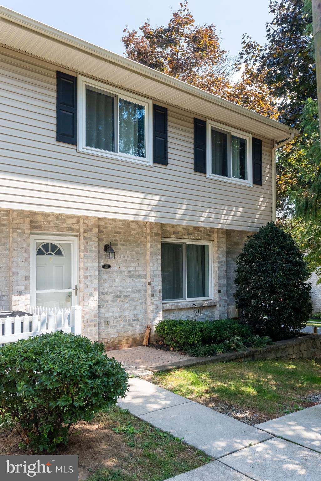 Welcome to 200 Village Walk, a beautiful, brick end unit located in Village Walk Condominium of Exton in Downingtown Area School District. This two bedroom townhome features hardwood floors throughout the main level and plenty of natural light. Upon entering, the foyer leads you to a spacious living room which opens to the dining area. In the galley kitchen, you will find a new stove, stainless refrigerator, and fresh, white cabinetry. The main floor also offers a pantry and under stair storage and is finished with a half bathroom. Carpeting leads up the stairs to the second story. At the end of the hall, a large main bedroom awaits with plenty of space for furniture and also offers a spacious walk-in closet. The next room is perfect as an extra bedroom or in-home office space. Both rooms are serviced by a full bath with shower/tub combo and vanity. The hall closet has in-home laundry with washer and dryer. Village Walk Community is a fantastic, low-maintenance living opportunity that includes a pool to enjoy during the hot summer months. This neighborhoods' close proximity to the mall, highways, restaurants and other amenities make it a great place to call home. This is it, Welcome home!